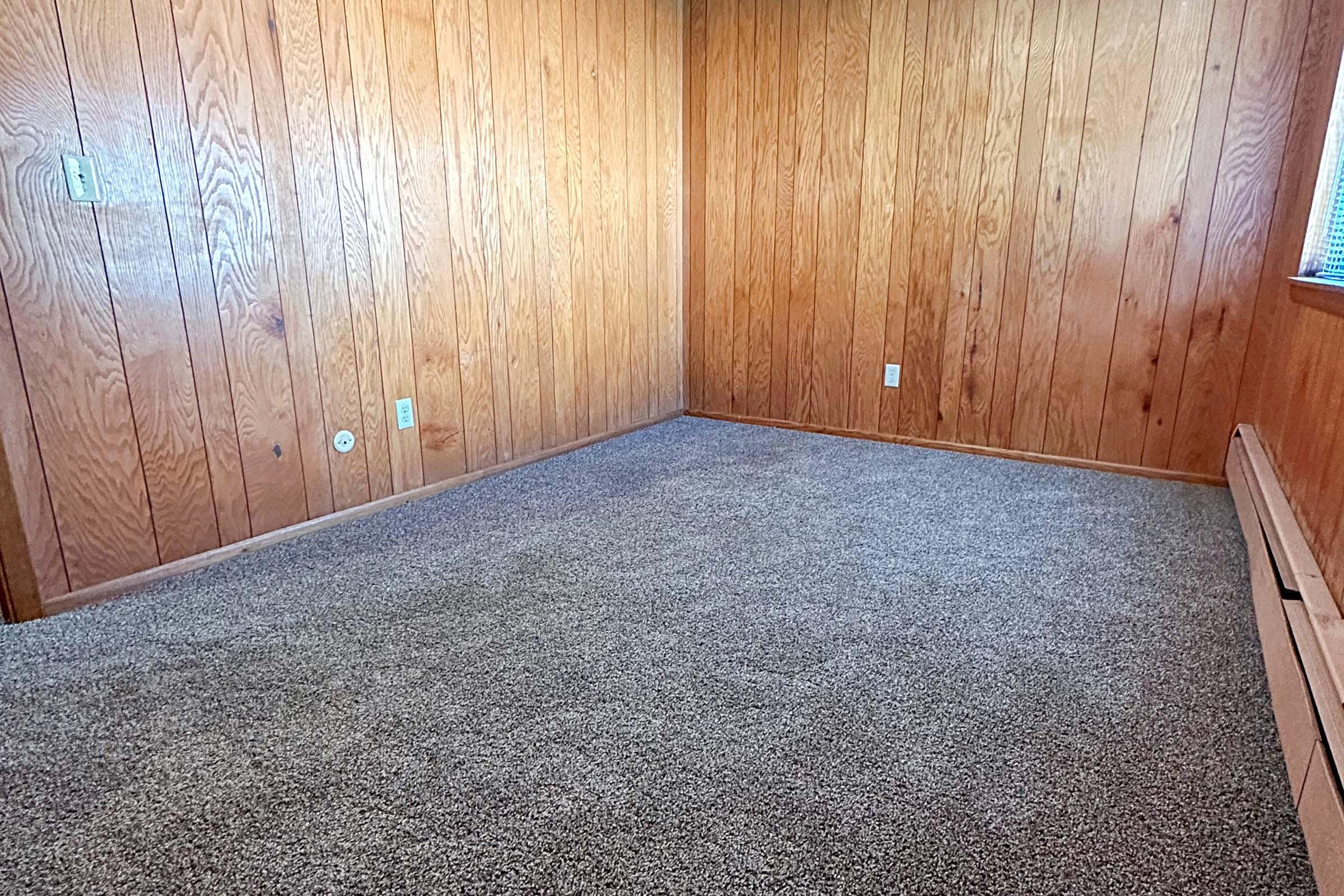 a bedroom with a wooden door