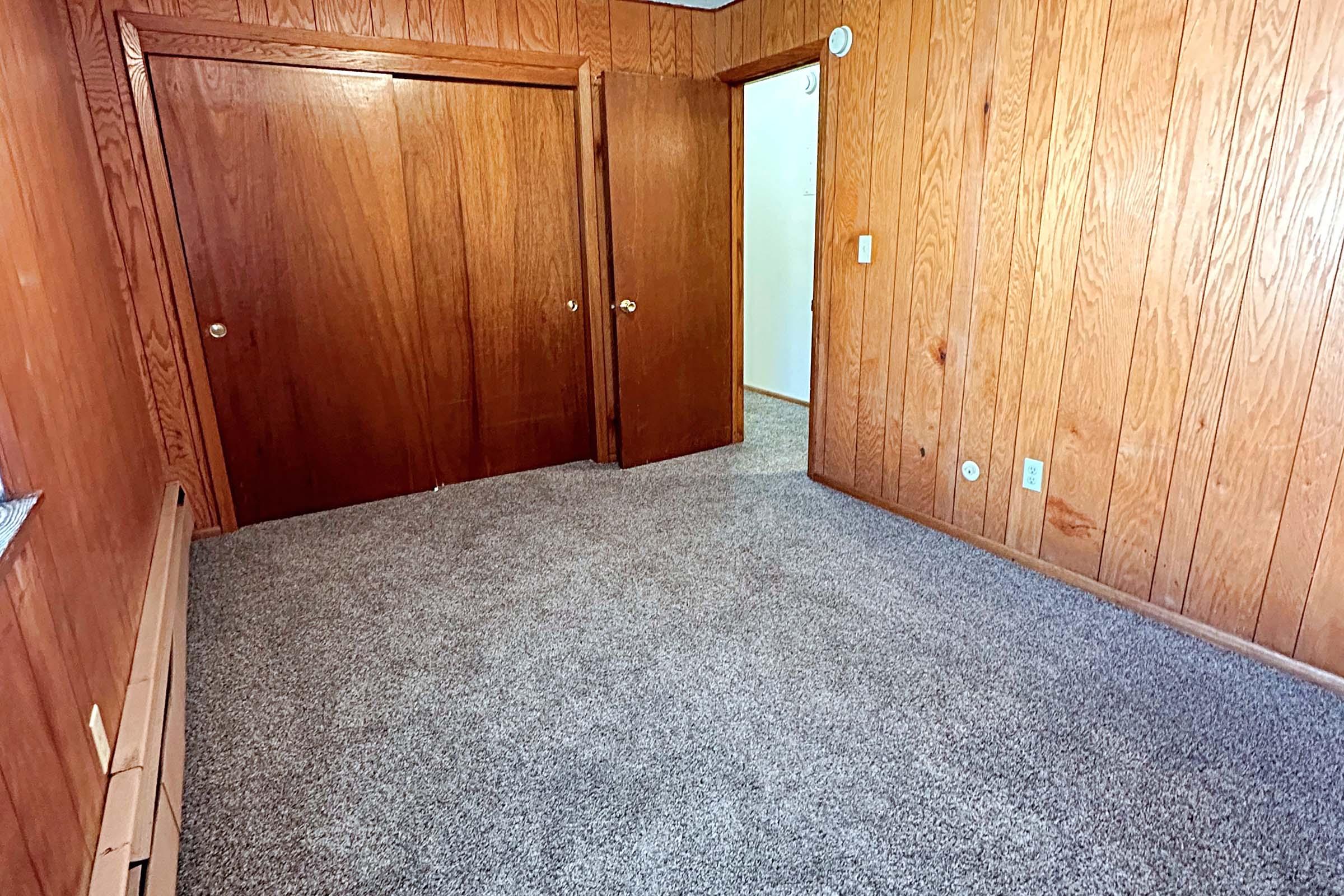 a bedroom with a wooden door