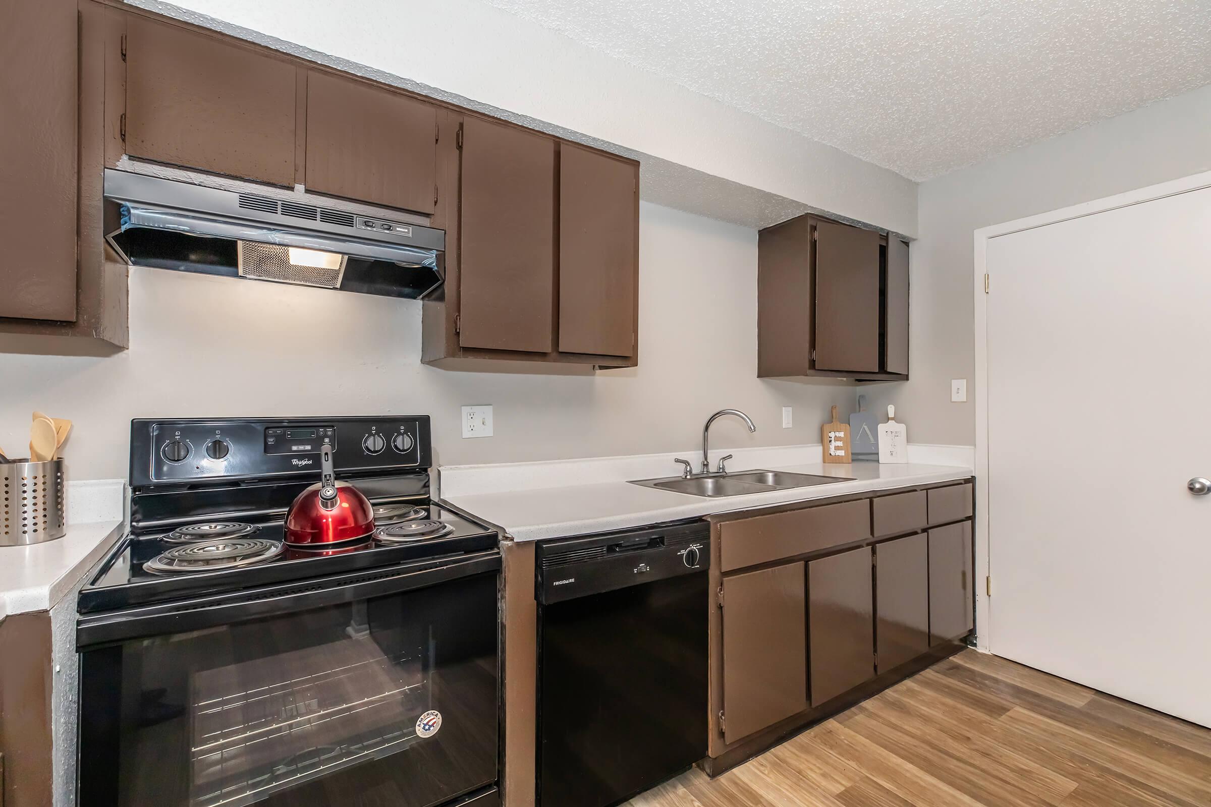 a kitchen with a sink and a microwave