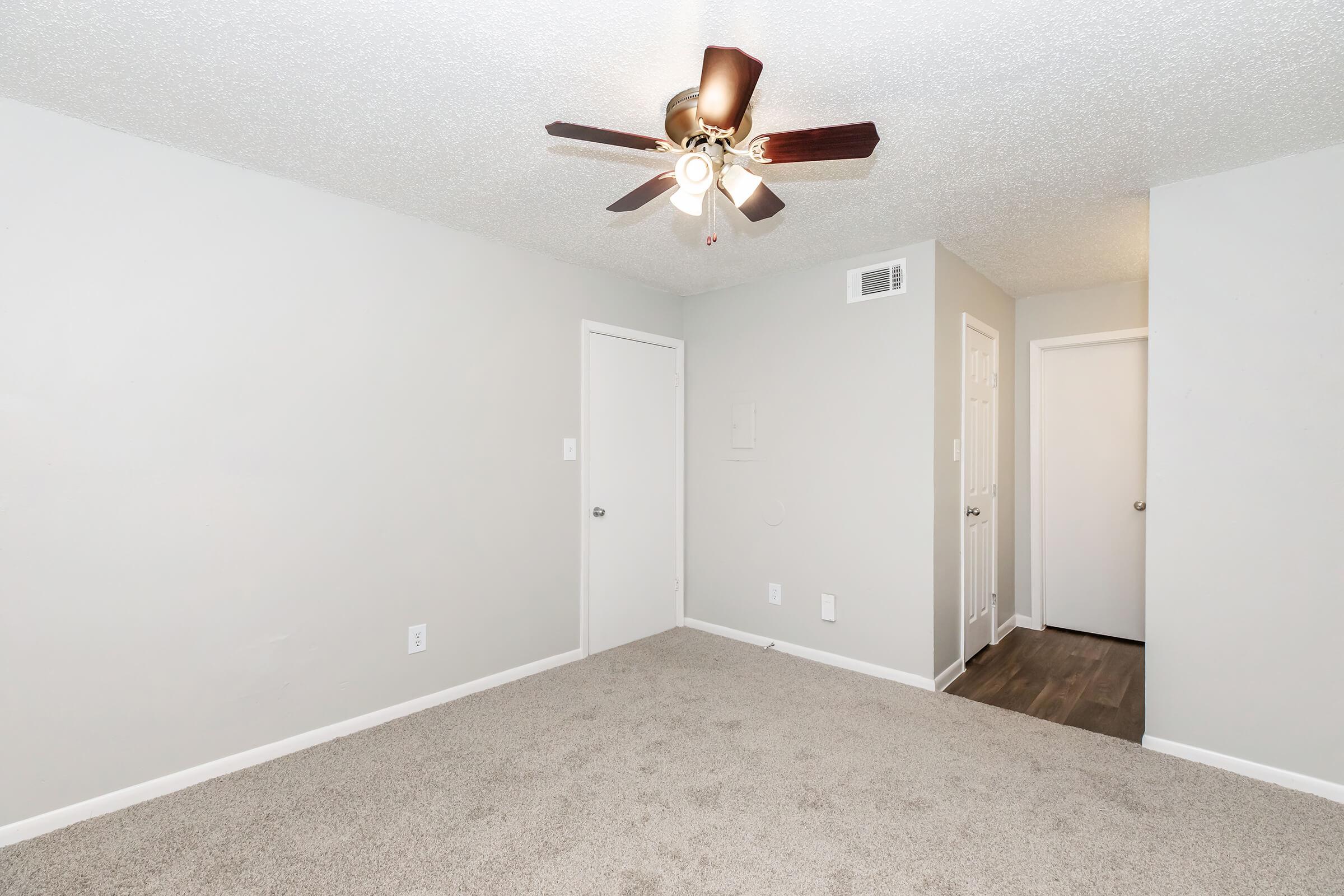 a bedroom with a large mirror