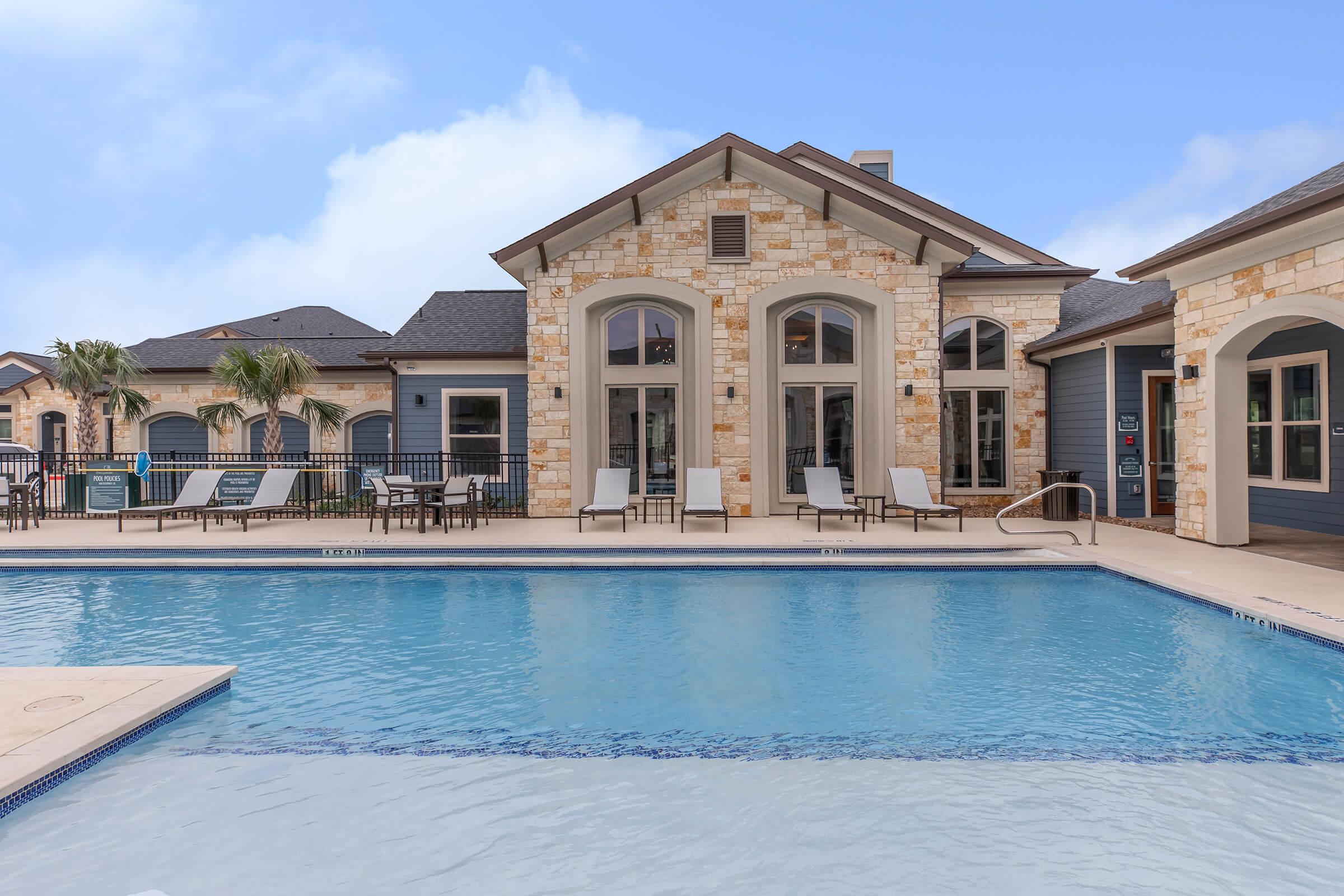 a house with a large pool of water