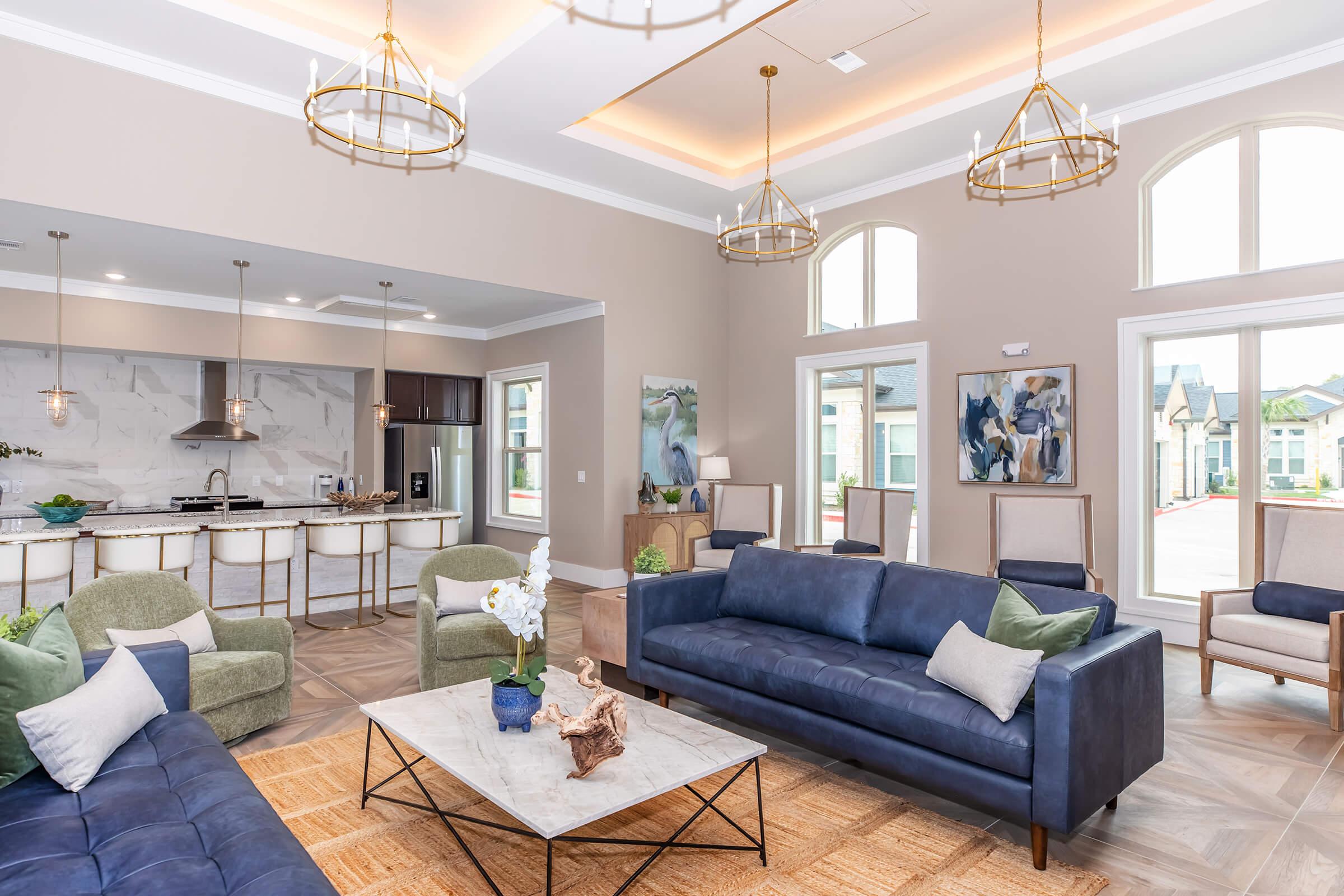 a living room filled with furniture and a large window