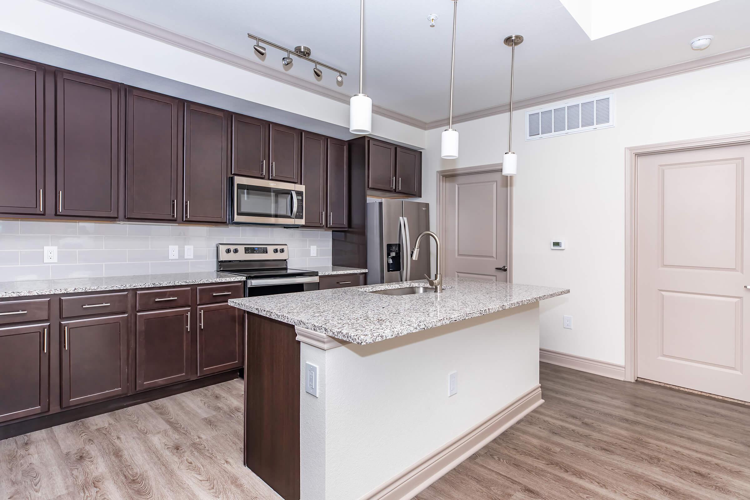 a kitchen with a sink and a window