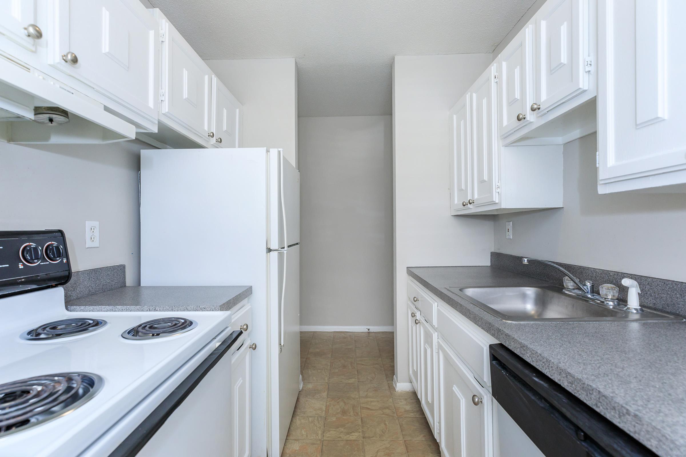 a kitchen with a white stove top oven