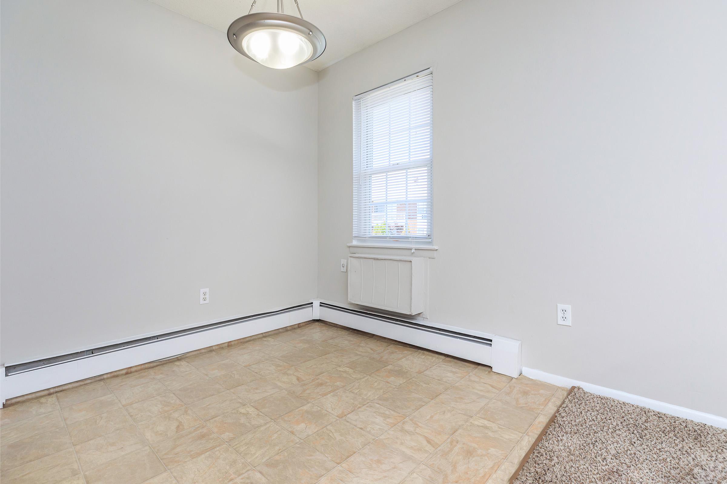 a bedroom with a large window