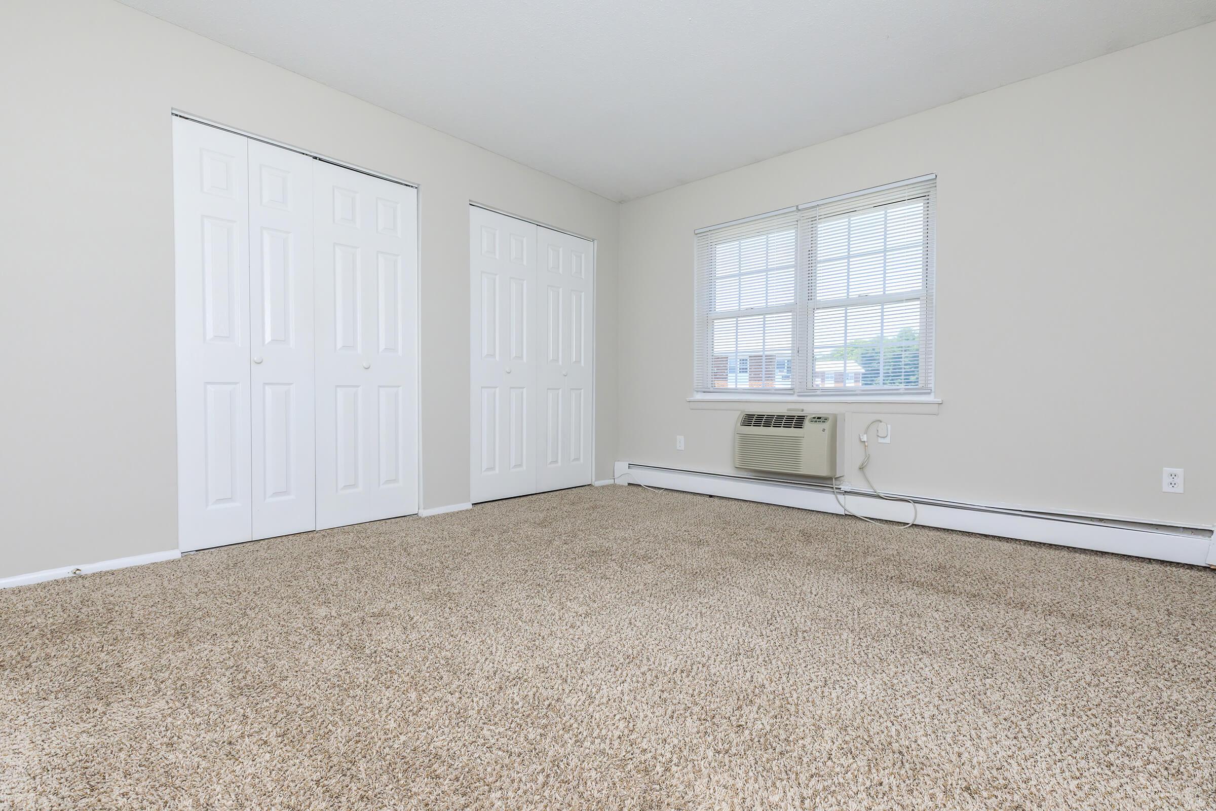 a room with a bed and a window