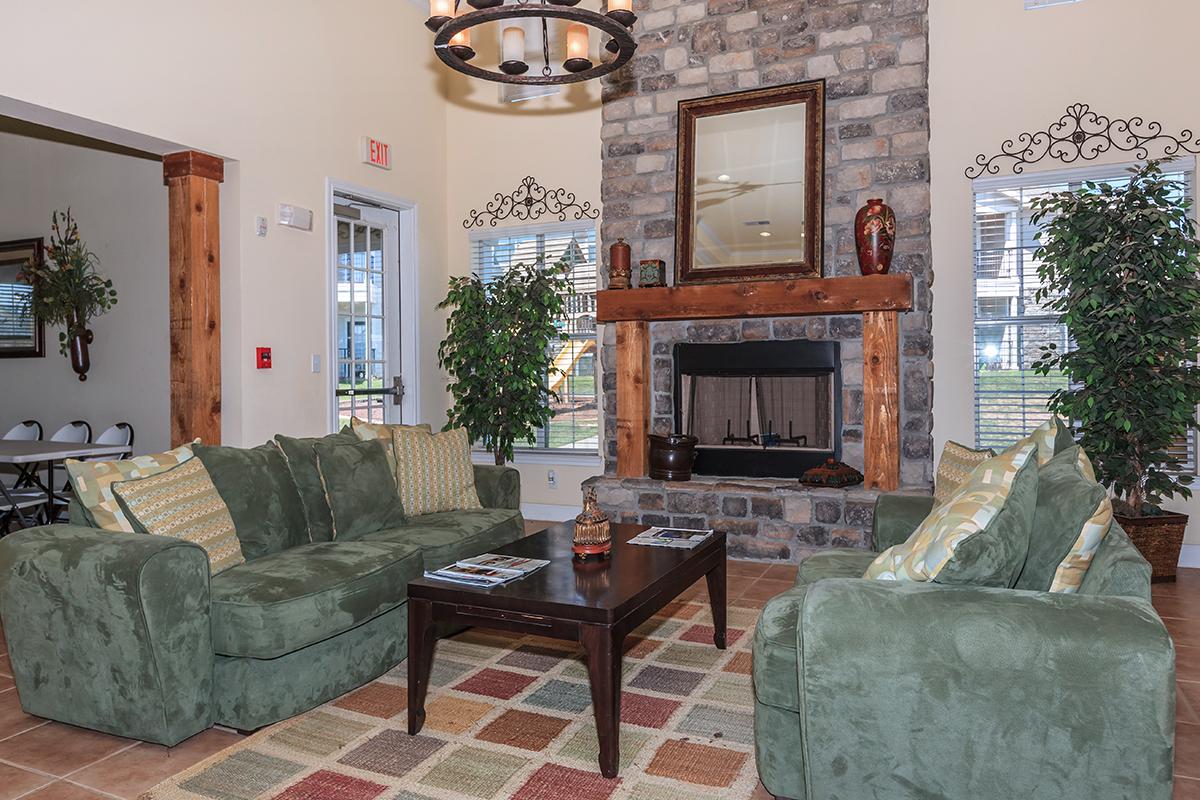a living room filled with furniture and a fire place