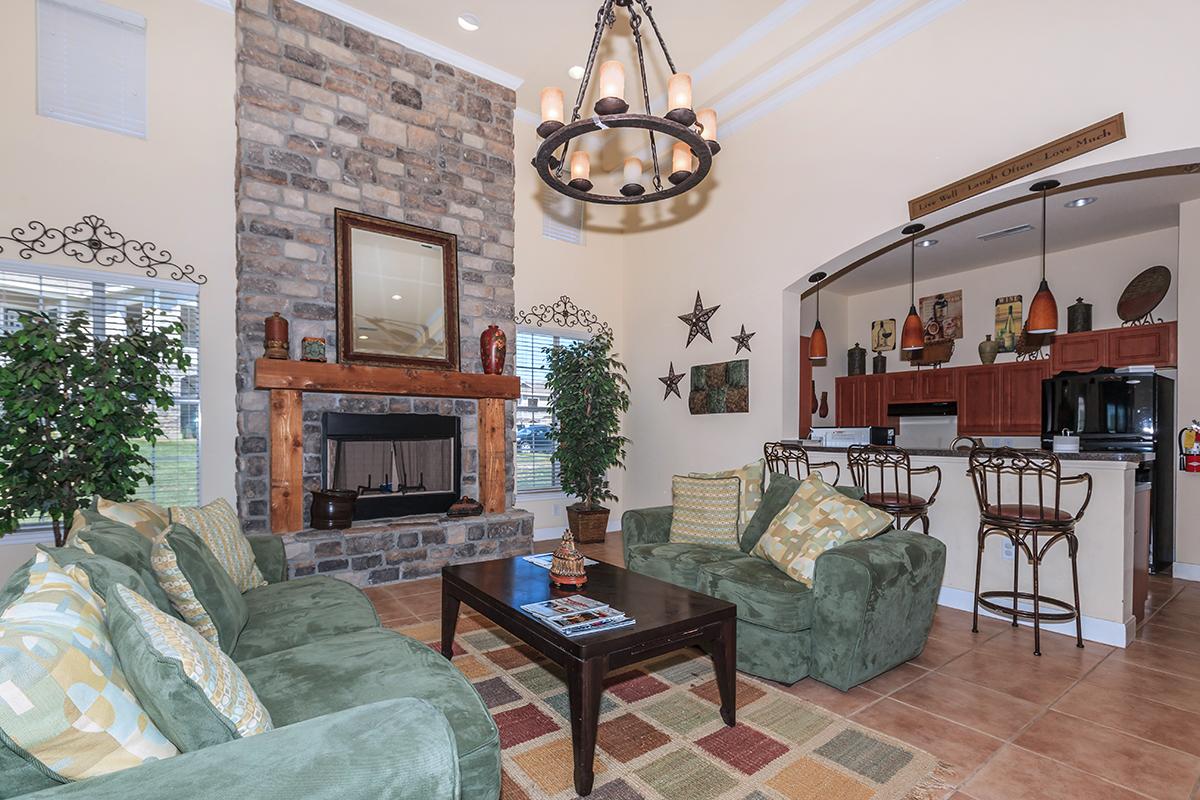 a living room filled with furniture and a fire place