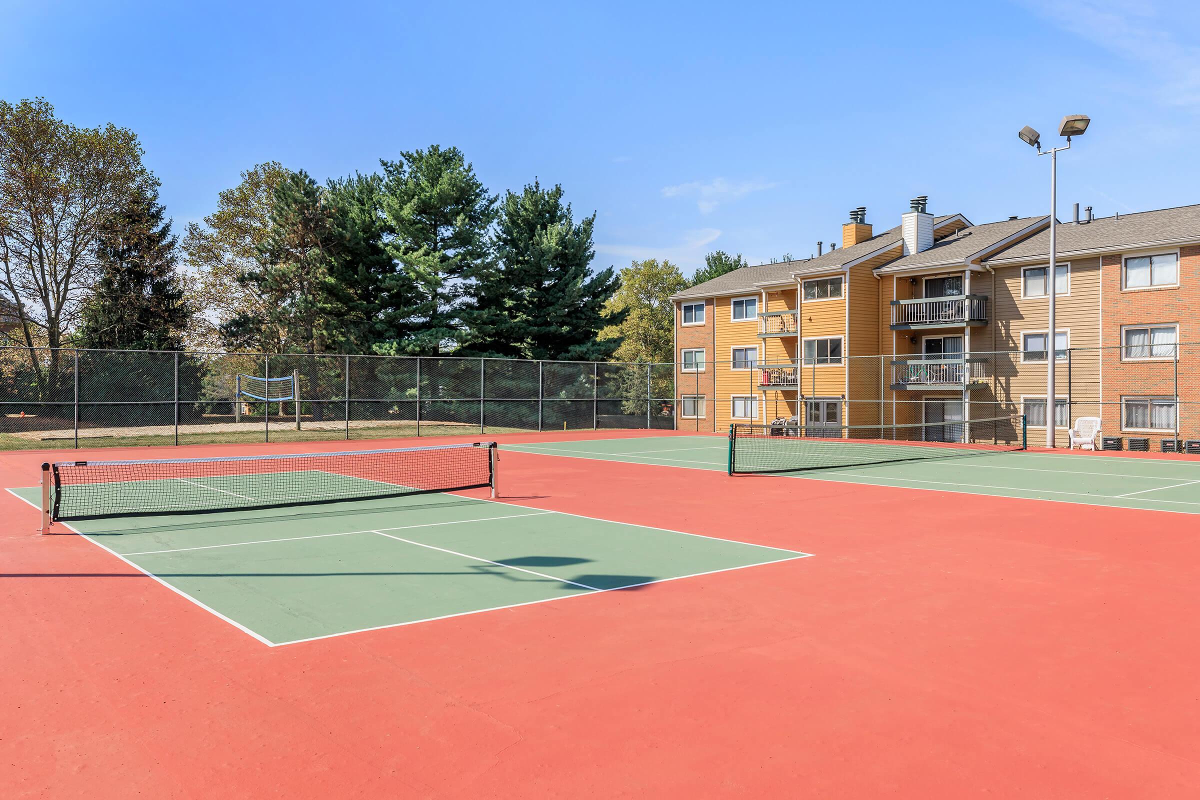 a basketball on a court with a racket