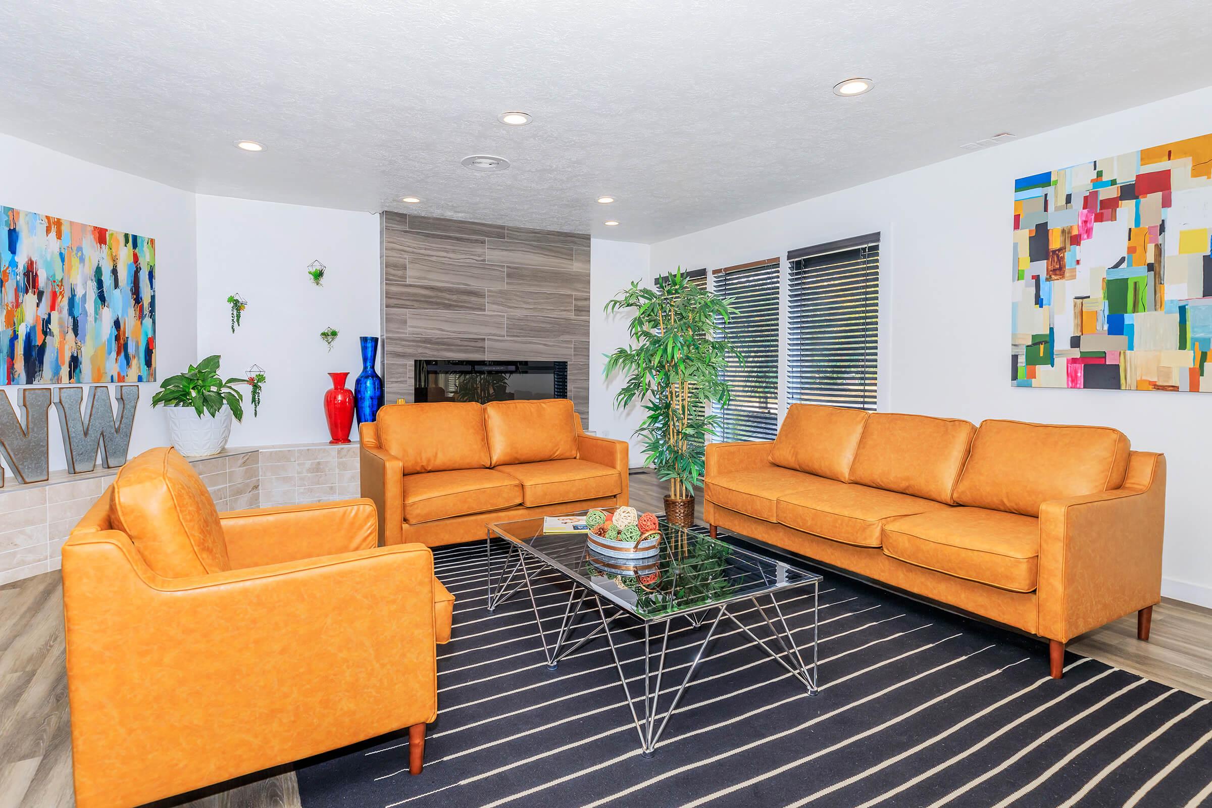 a living room filled with furniture and a flat screen tv