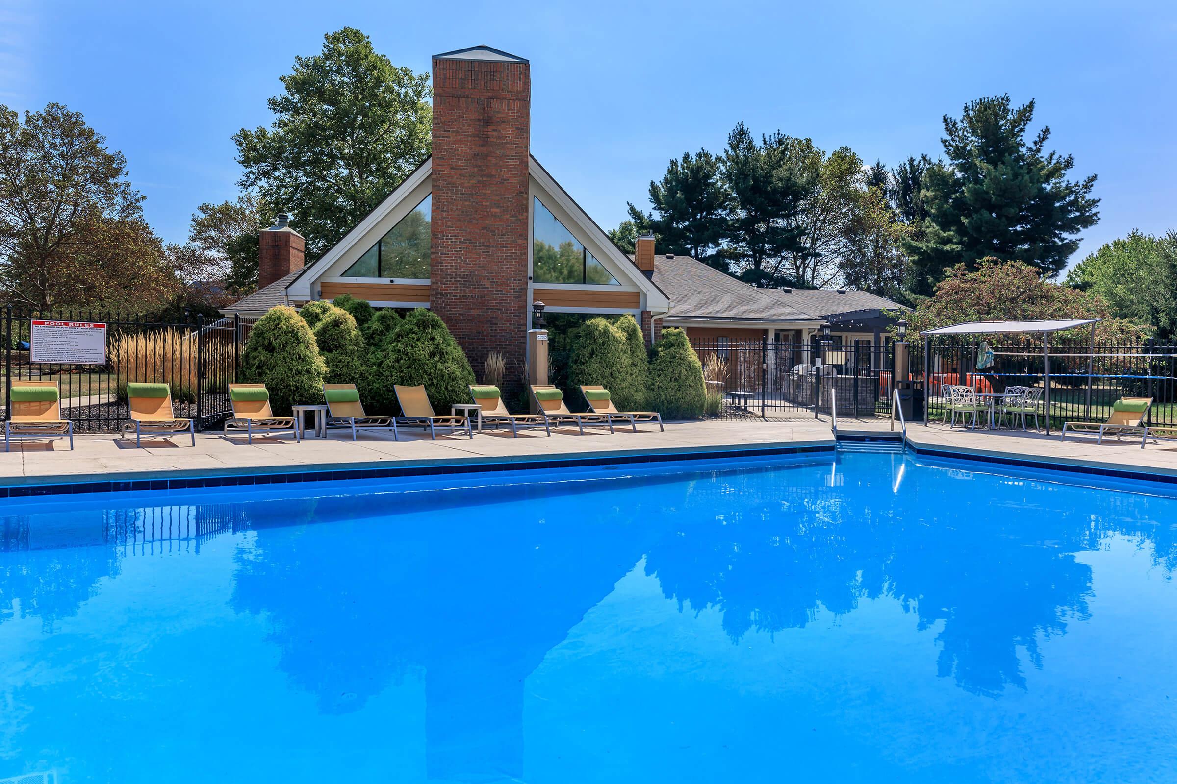 a large pool of water in front of a house