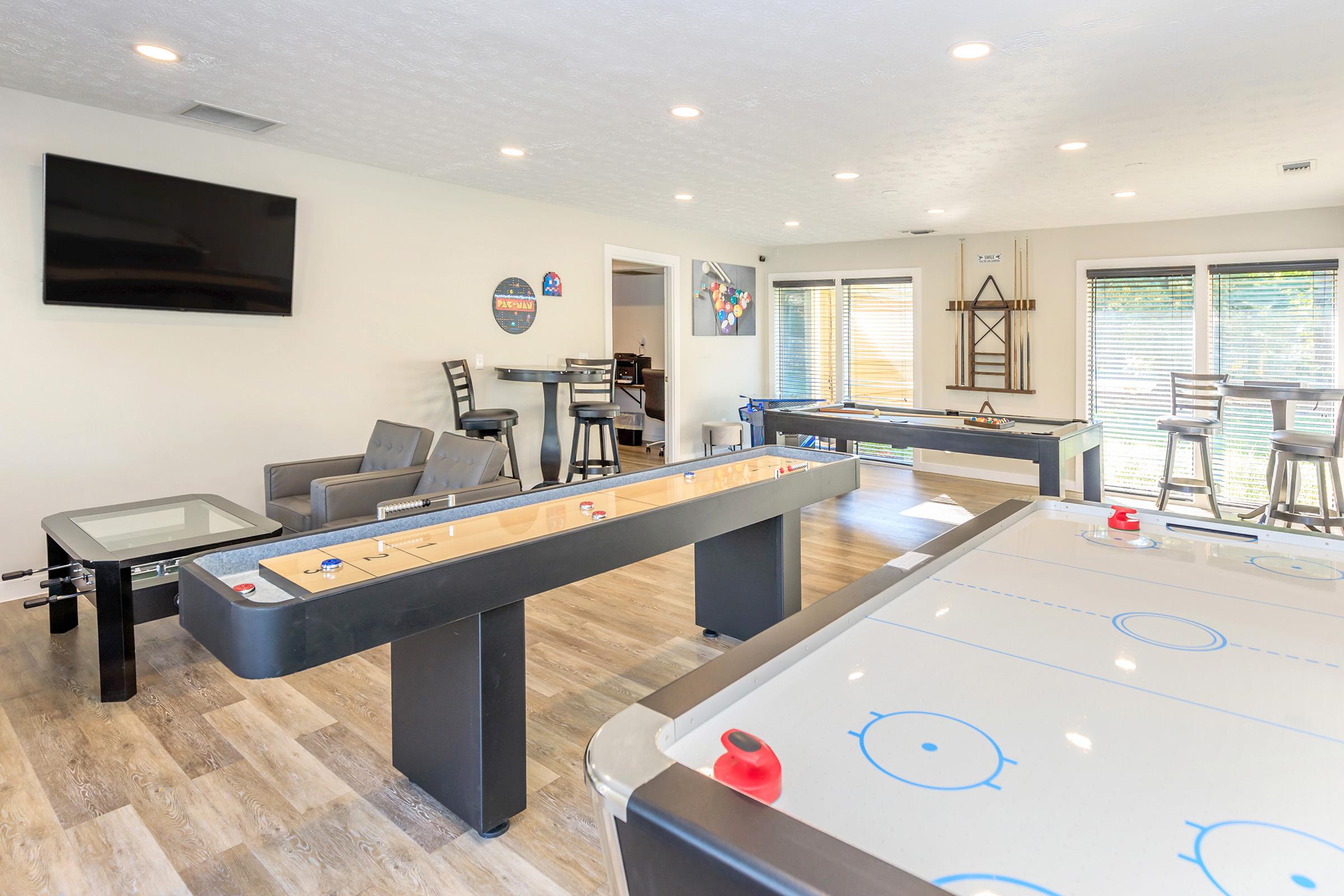 a room filled with furniture and a flat screen tv