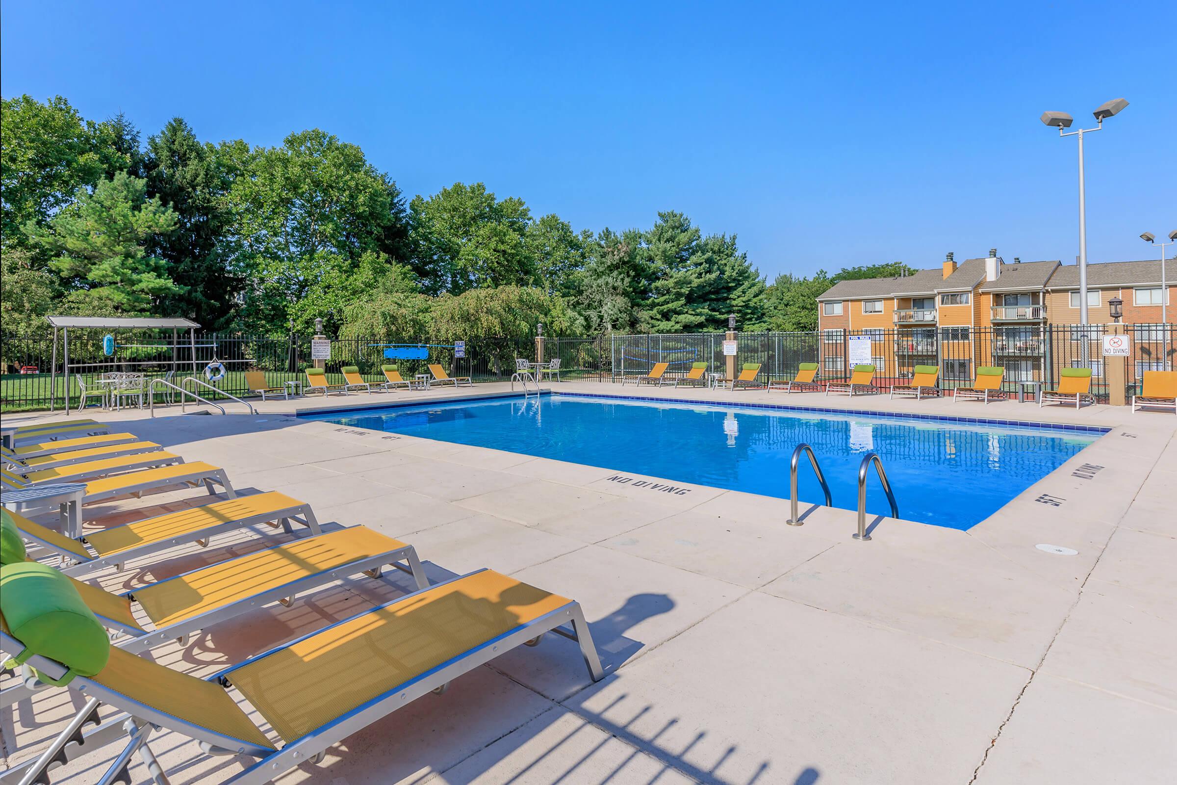 a chair sitting in front of a pool