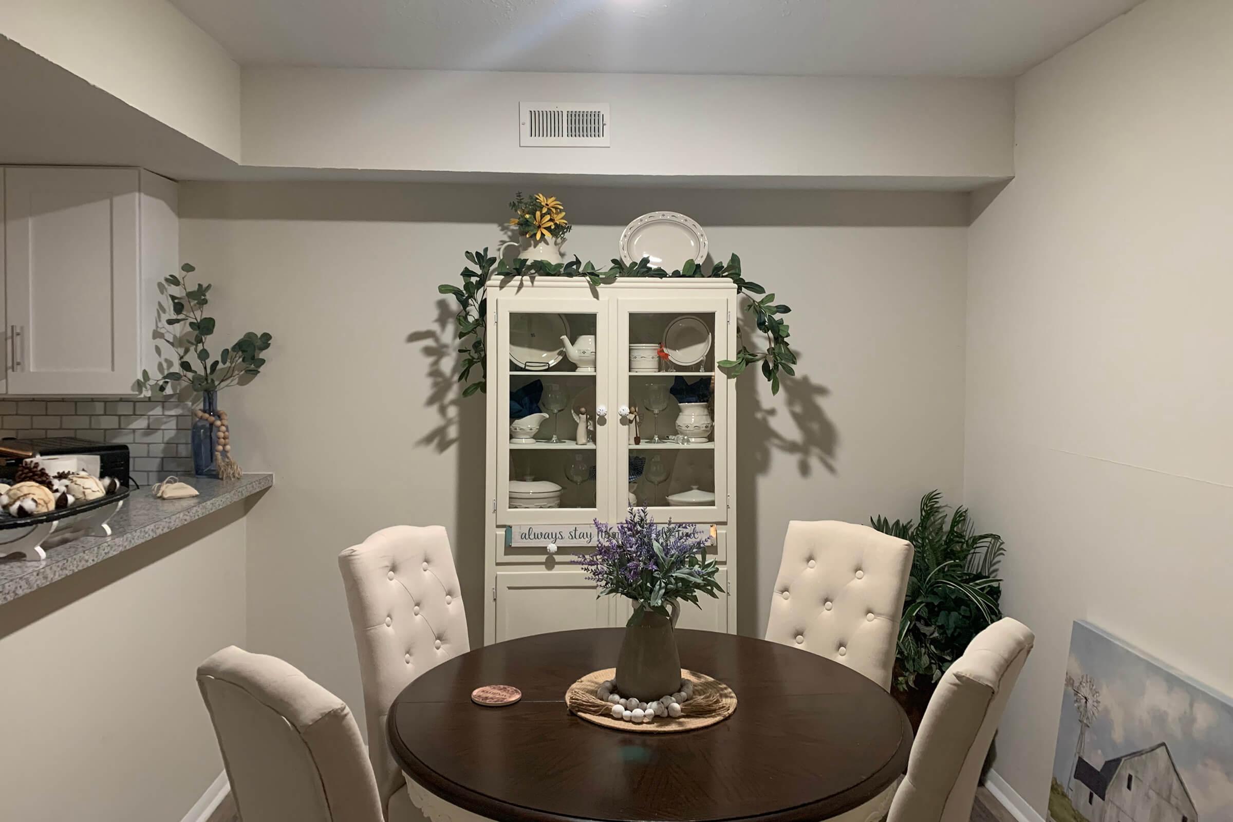 a living room filled with furniture and a mirror