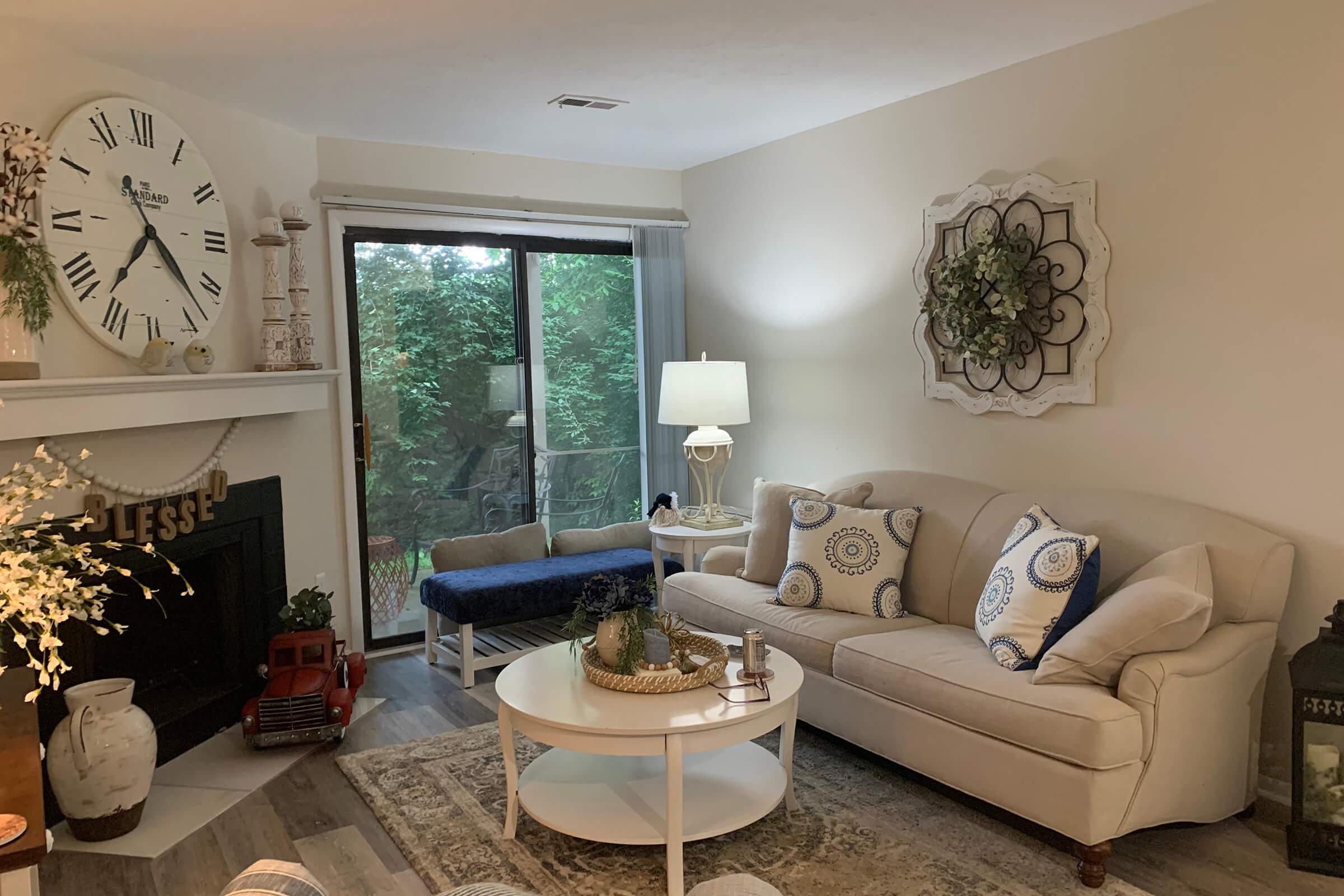 a living room filled with furniture and a fire place