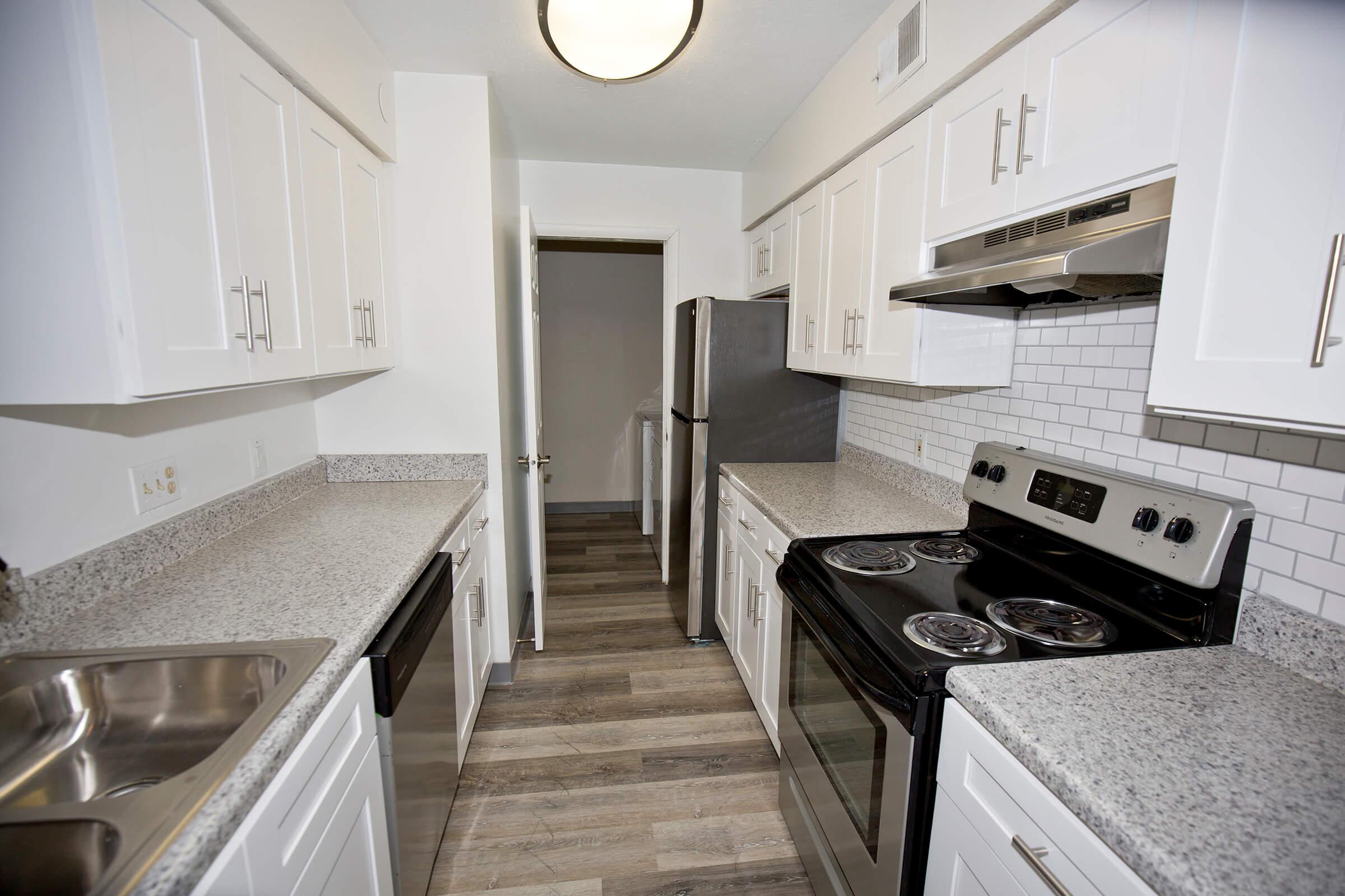 a large kitchen with stainless steel appliances