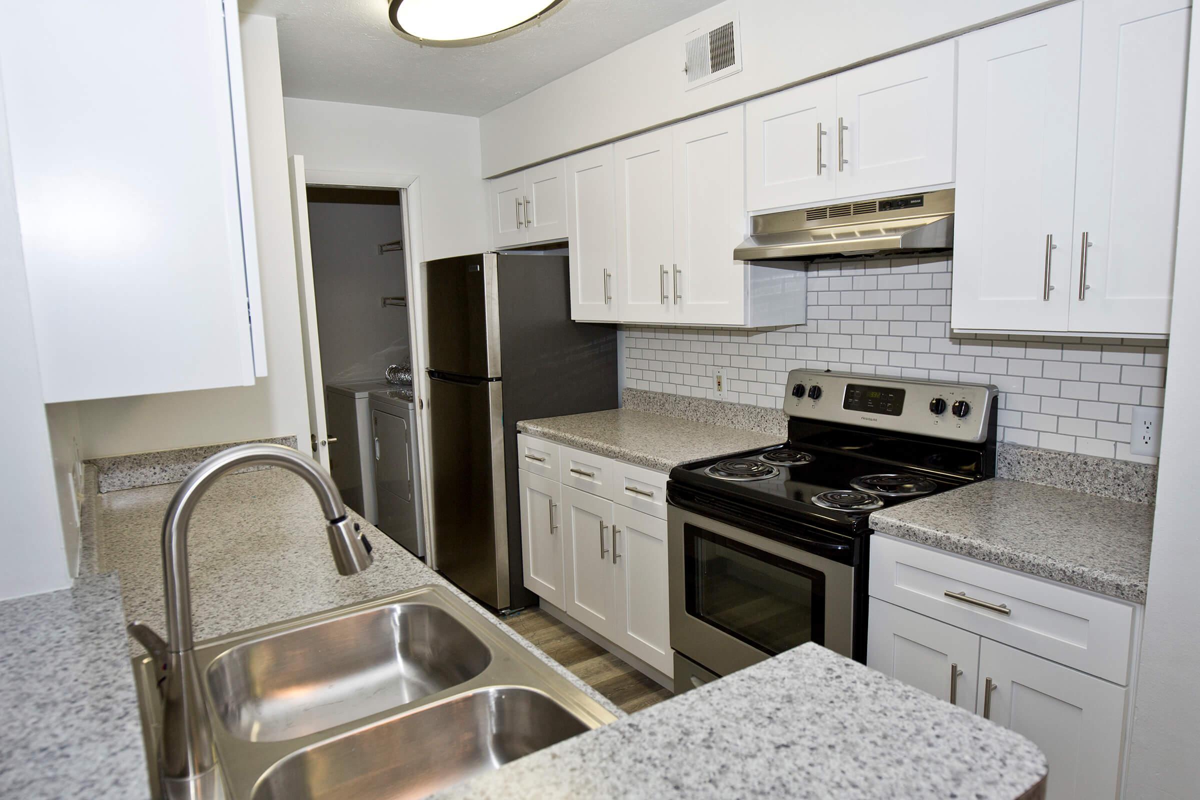 a kitchen with stainless steel appliances