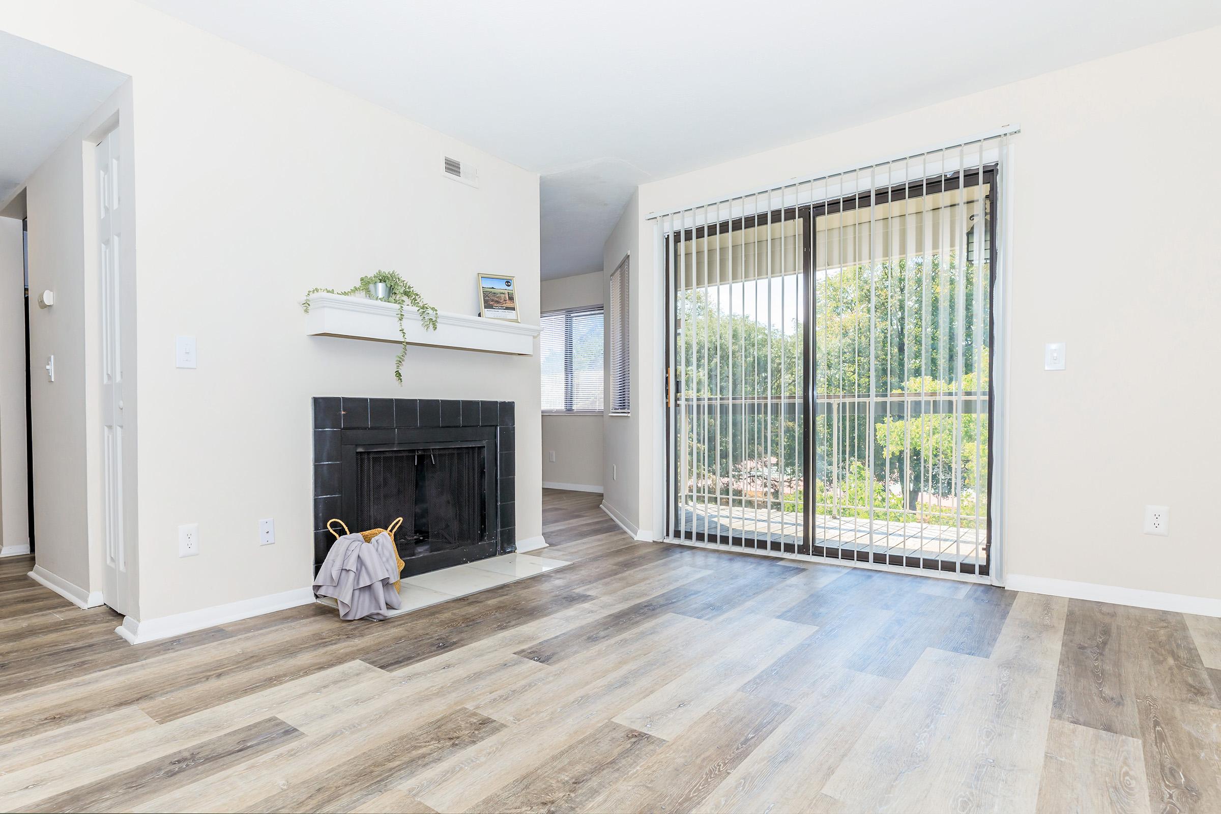 a living area with a building in the background