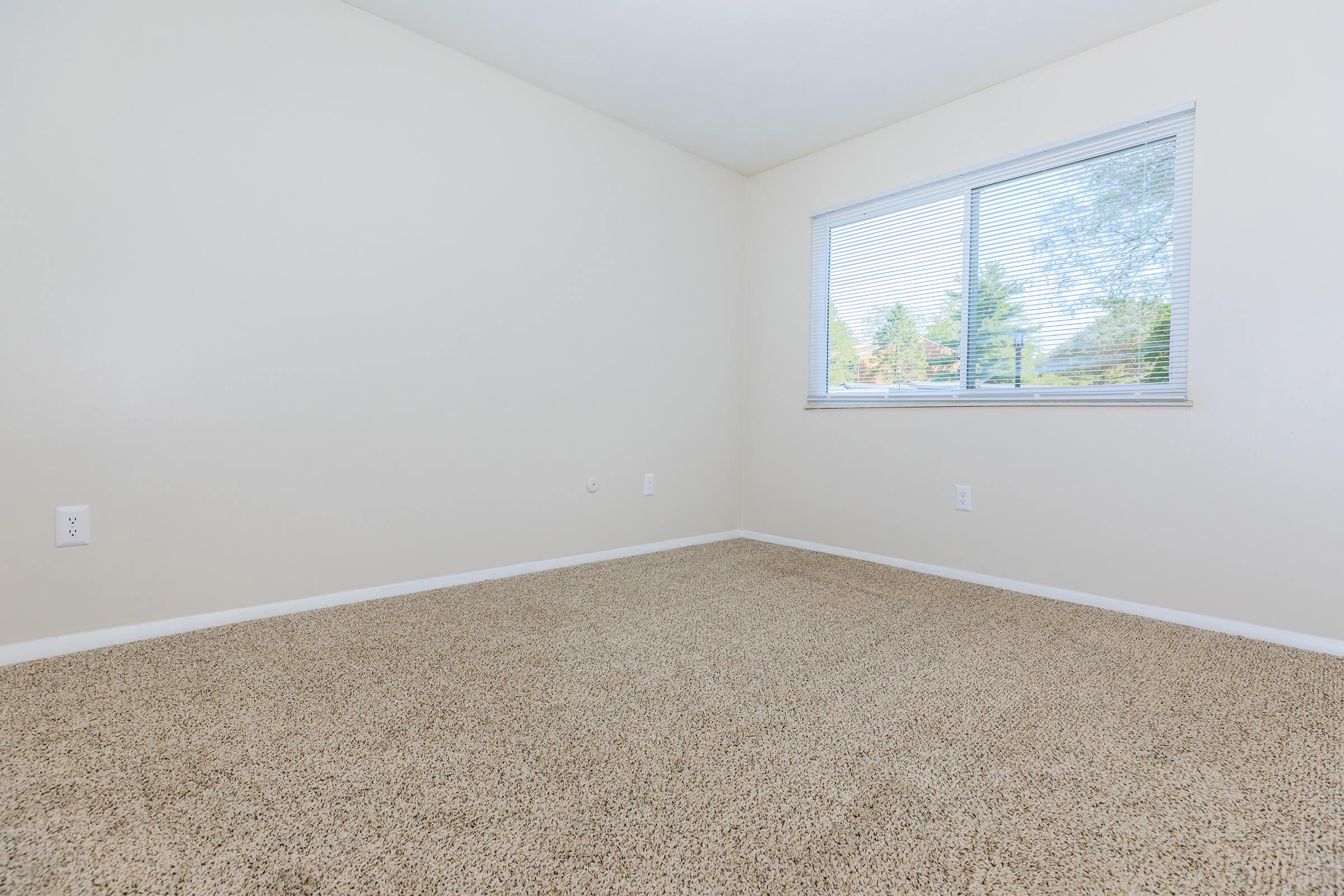 a bedroom with a large window