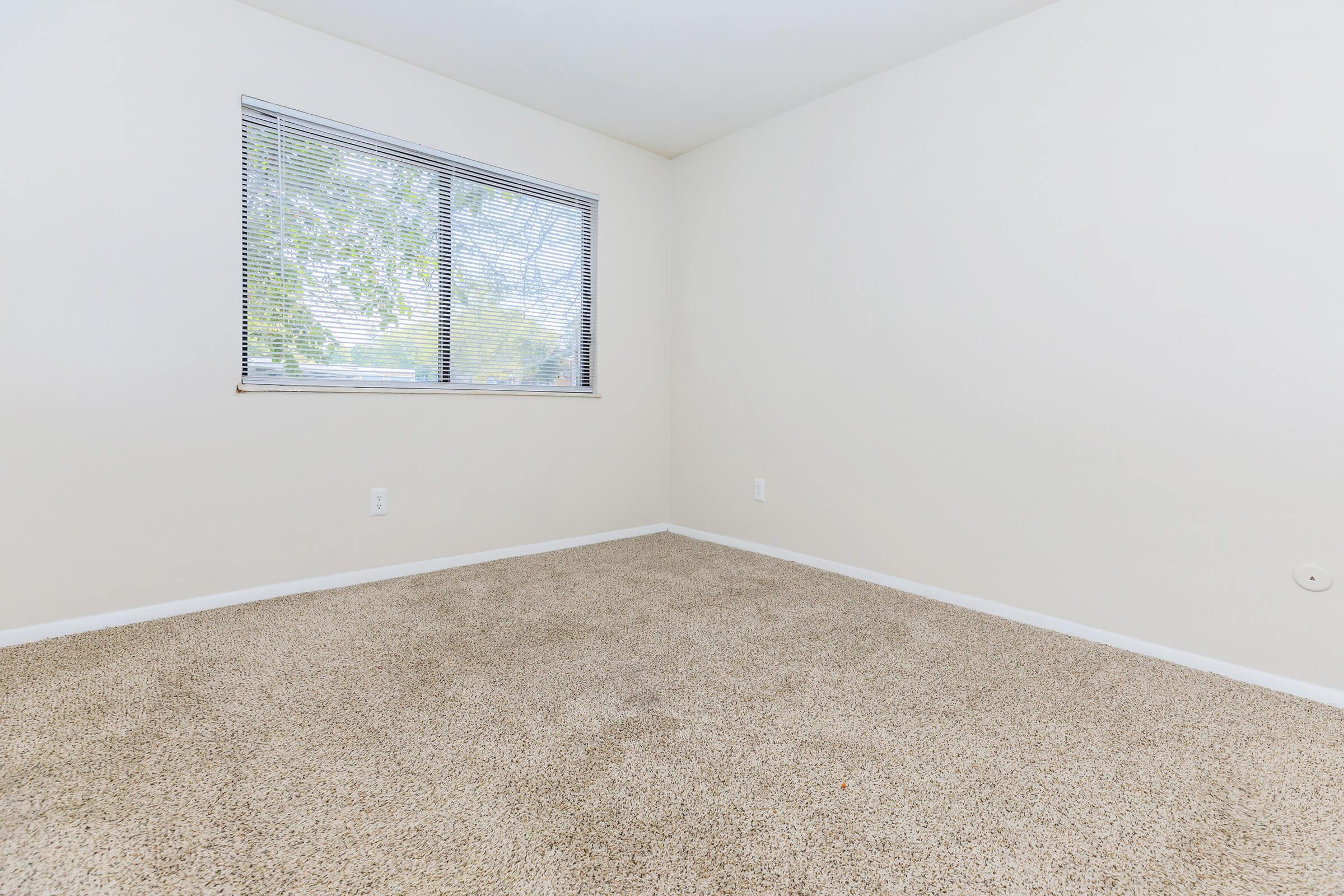 a bedroom with a large window