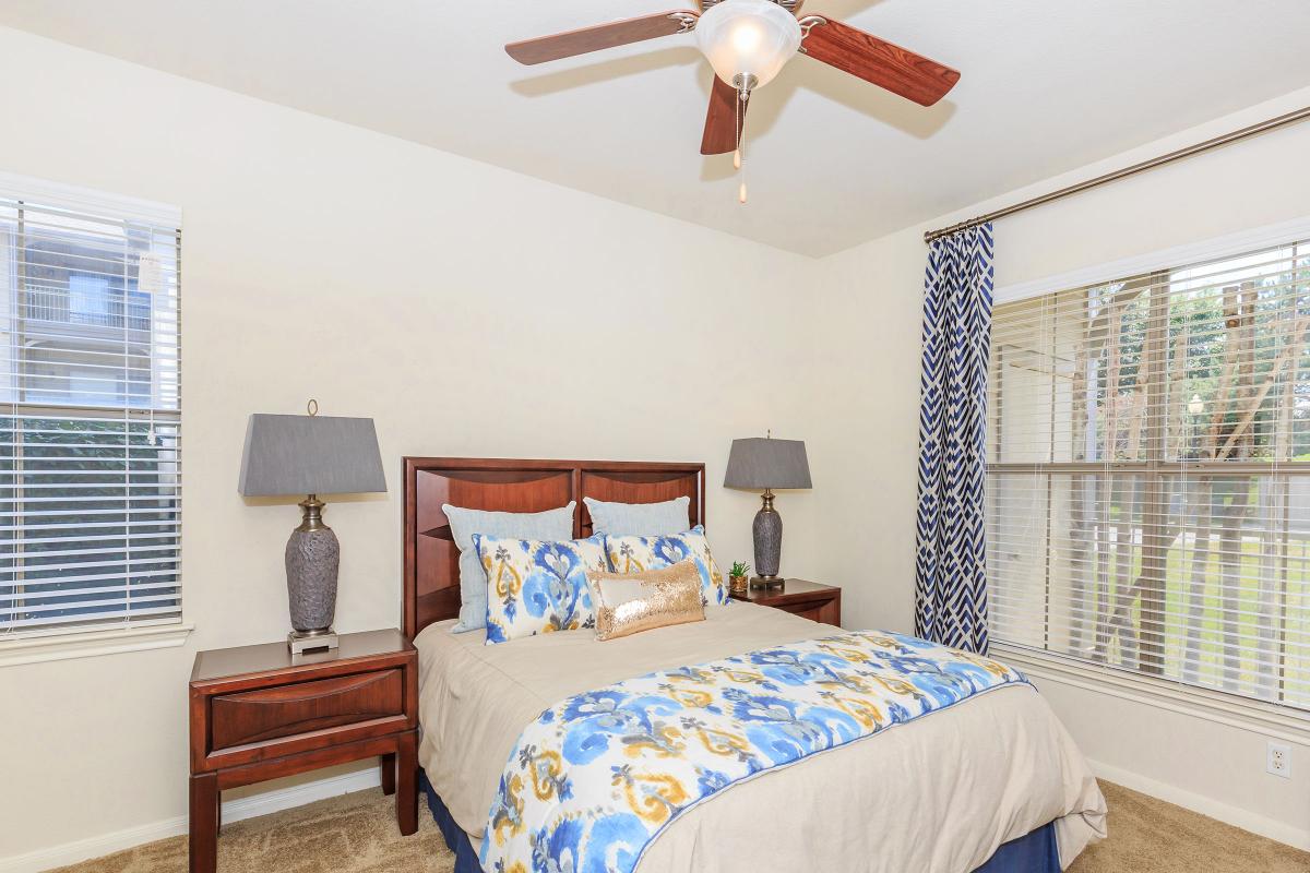 a bedroom with a bed in a room