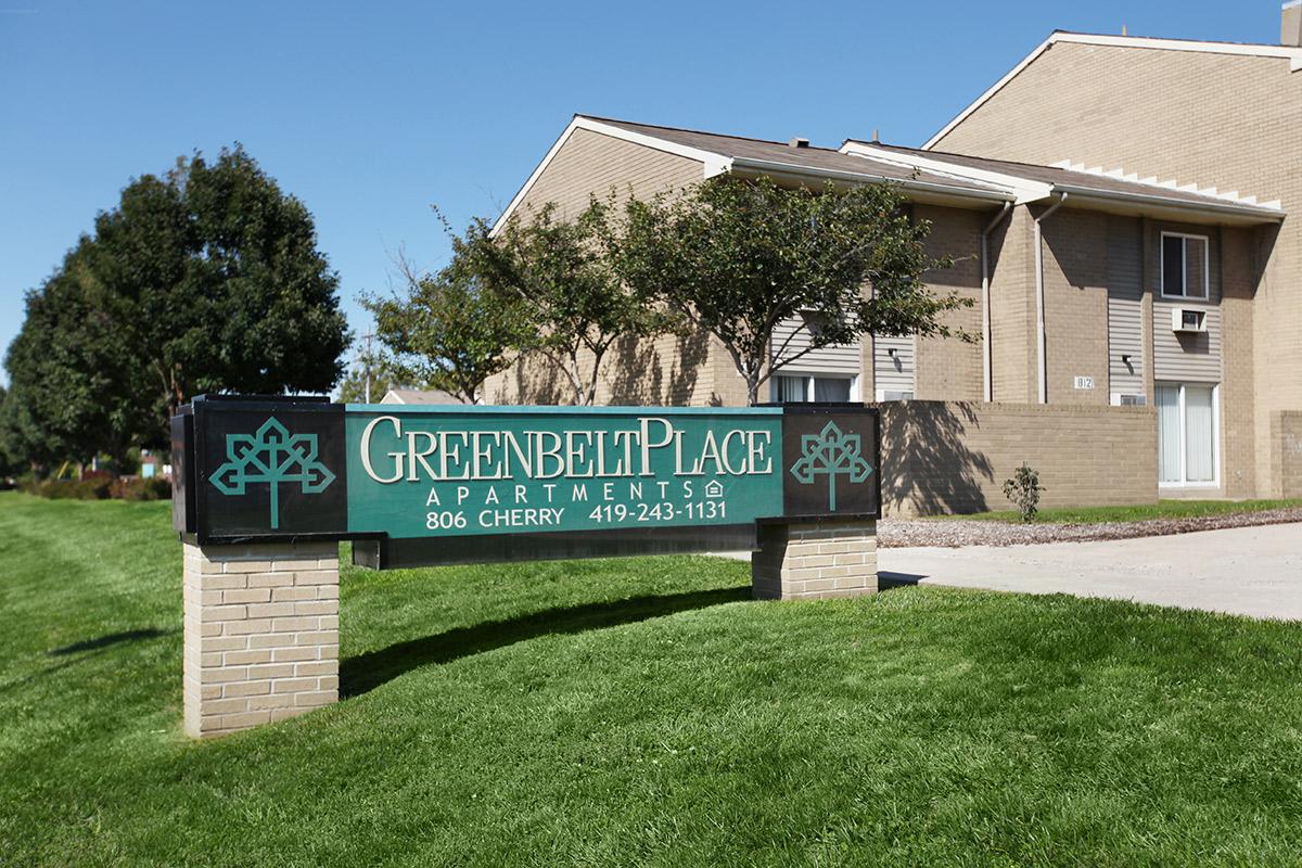 a sign in front of a house