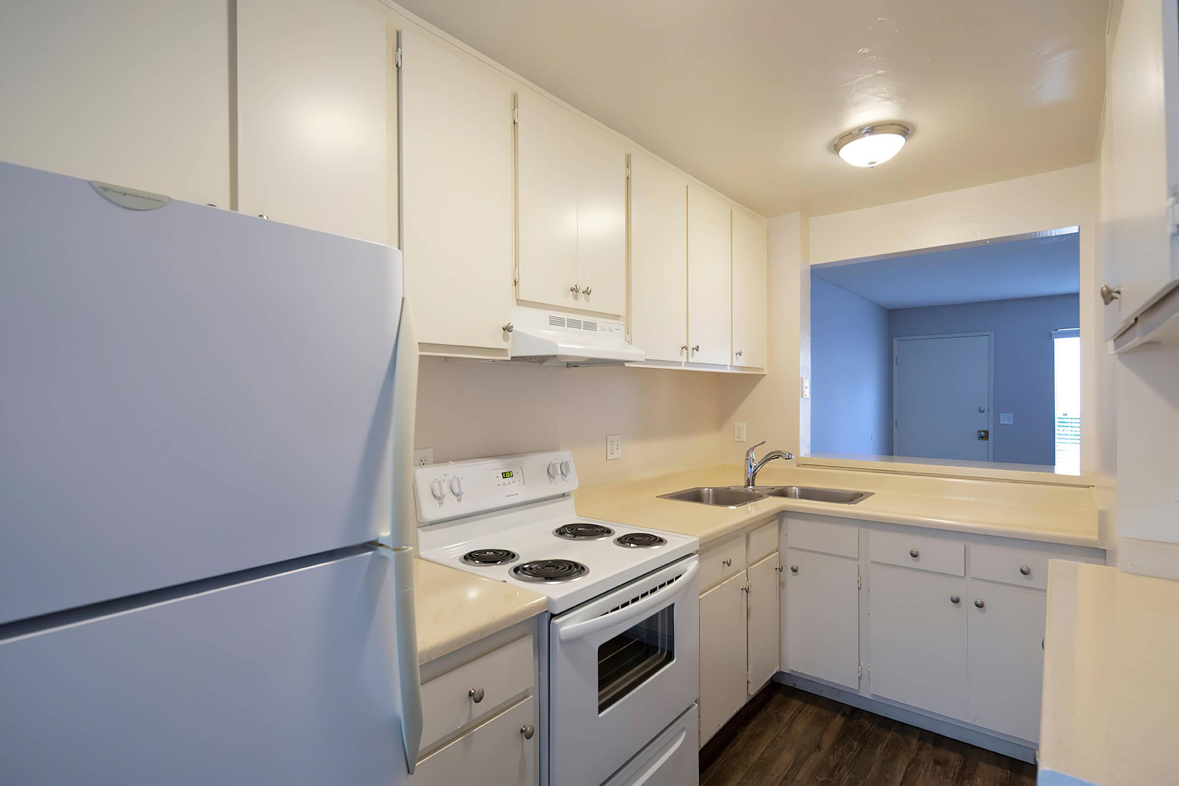 a kitchen with a stove top oven sitting inside of a refrigerator