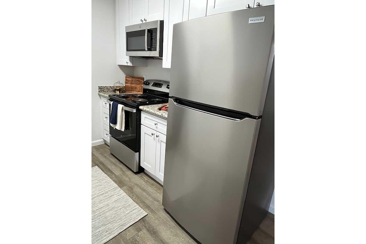 a stainless steel refrigerator in a kitchen