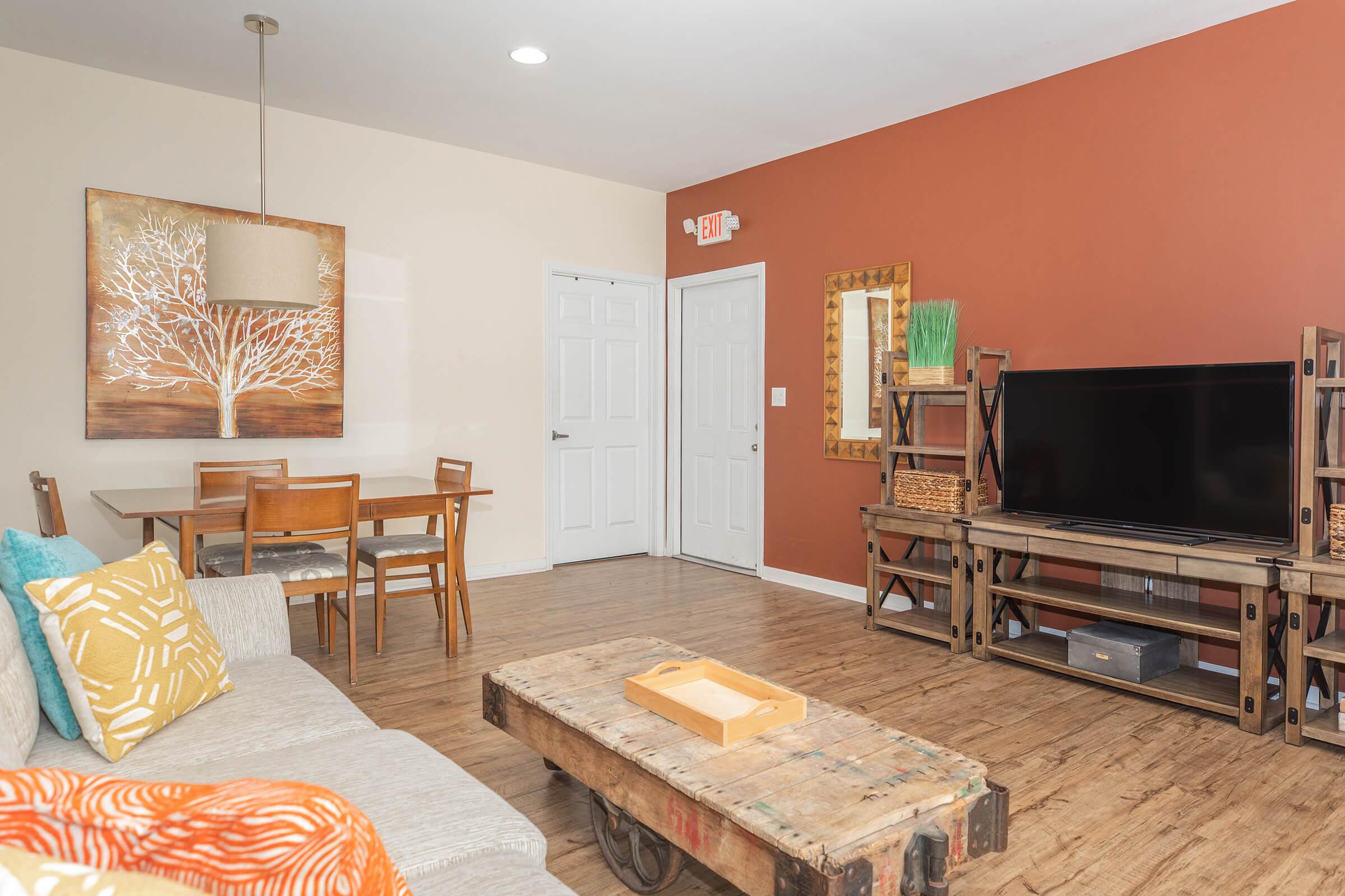 a living room filled with furniture and a fireplace