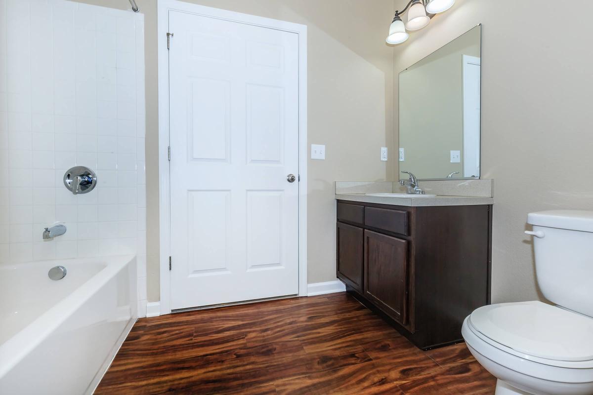 a large white tub next to a door