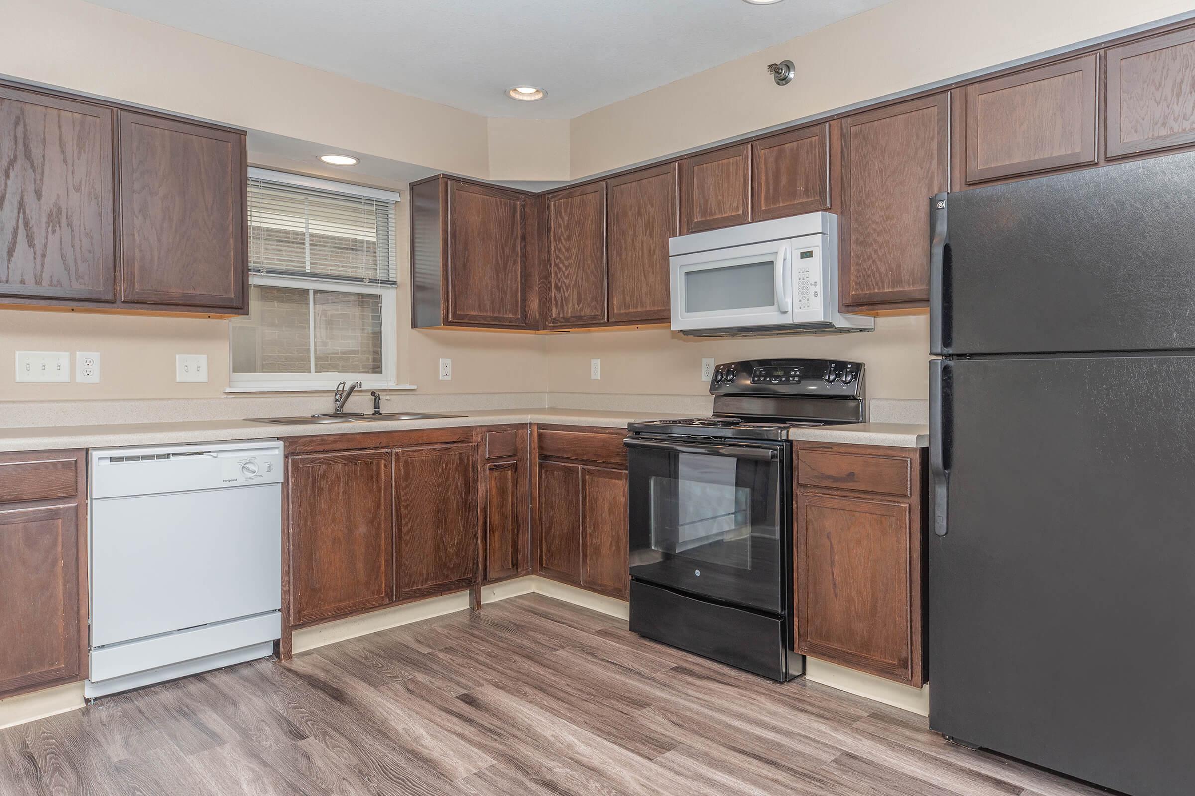 a kitchen with a stove and a refrigerator