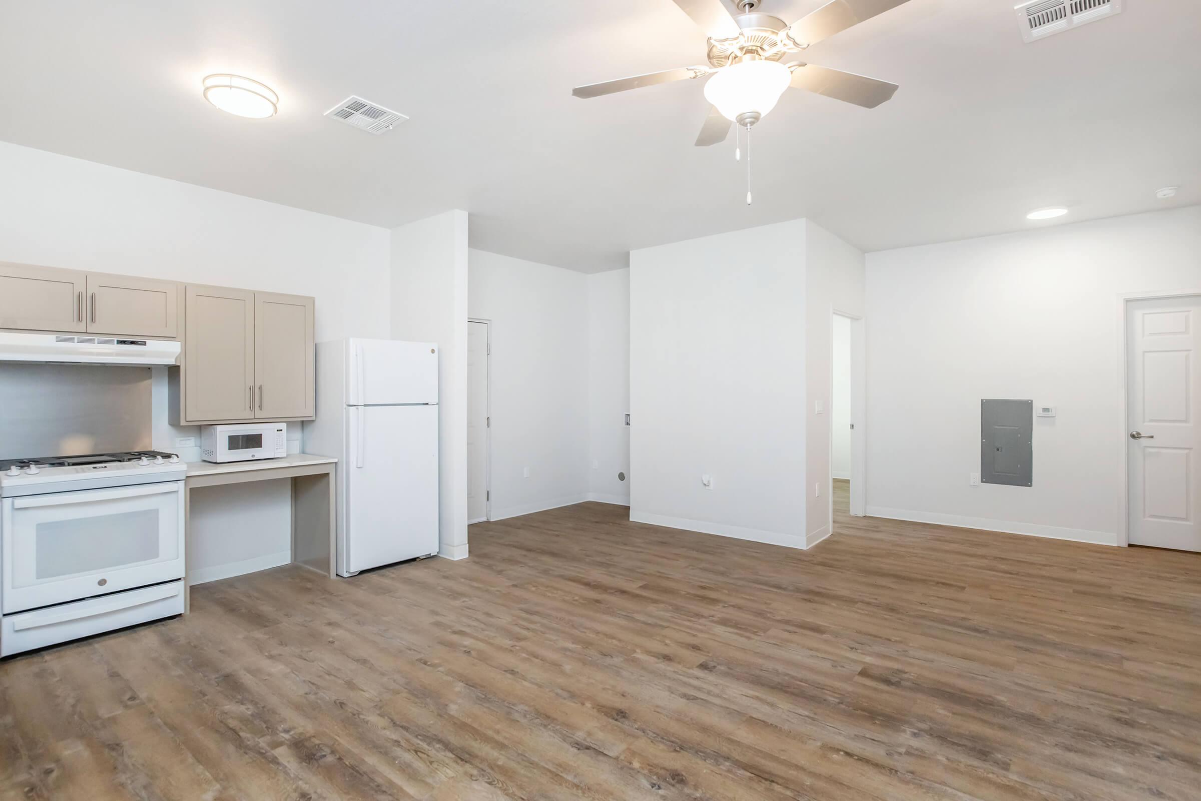 a kitchen with a wooden floor