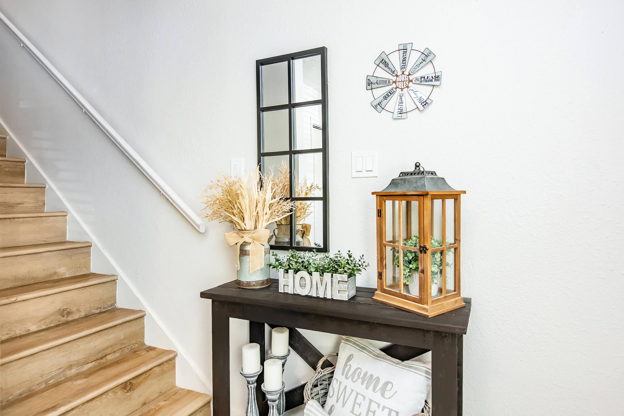 a clock sitting on top of a wooden table