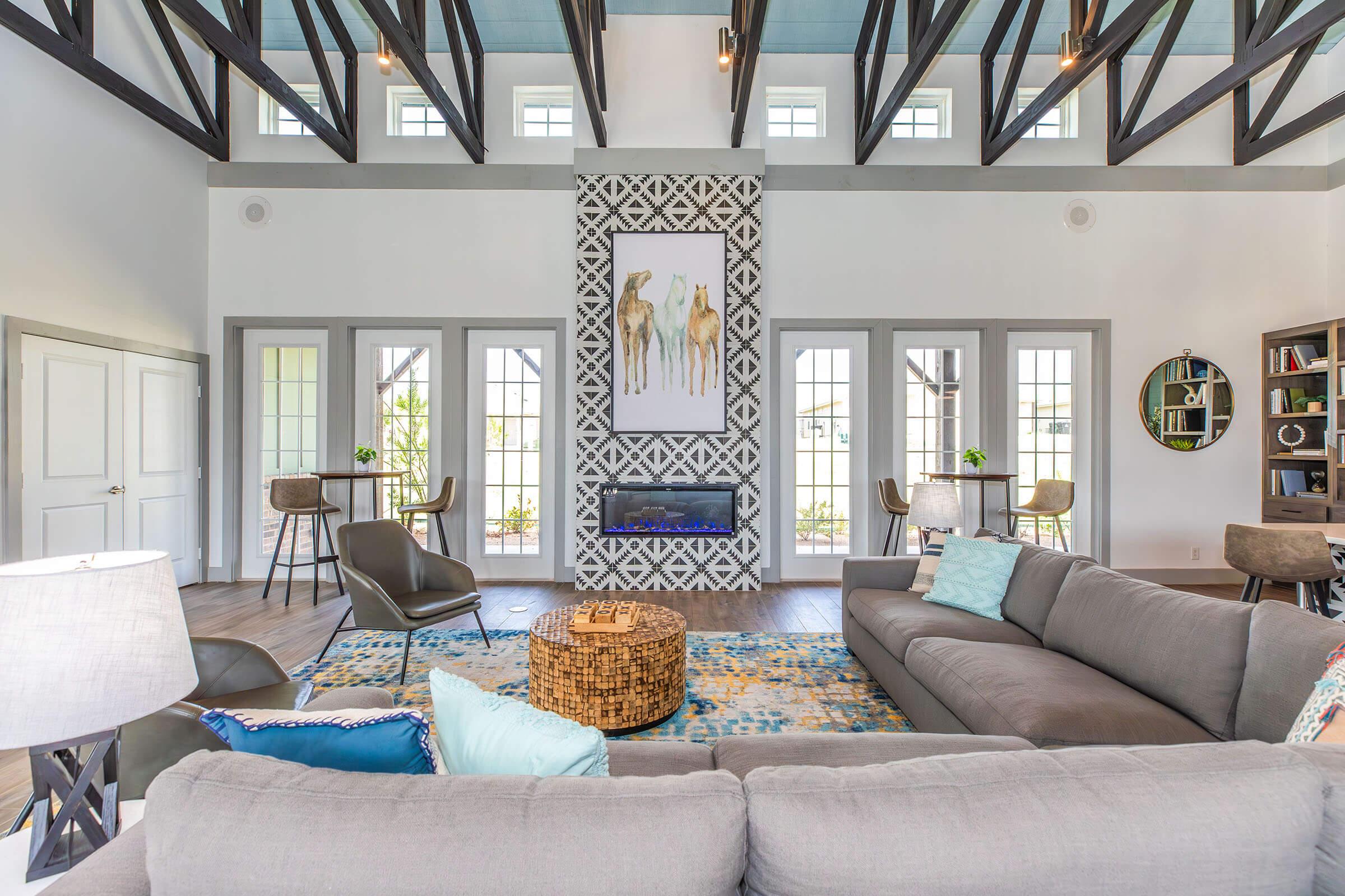 a living room filled with furniture and a large window