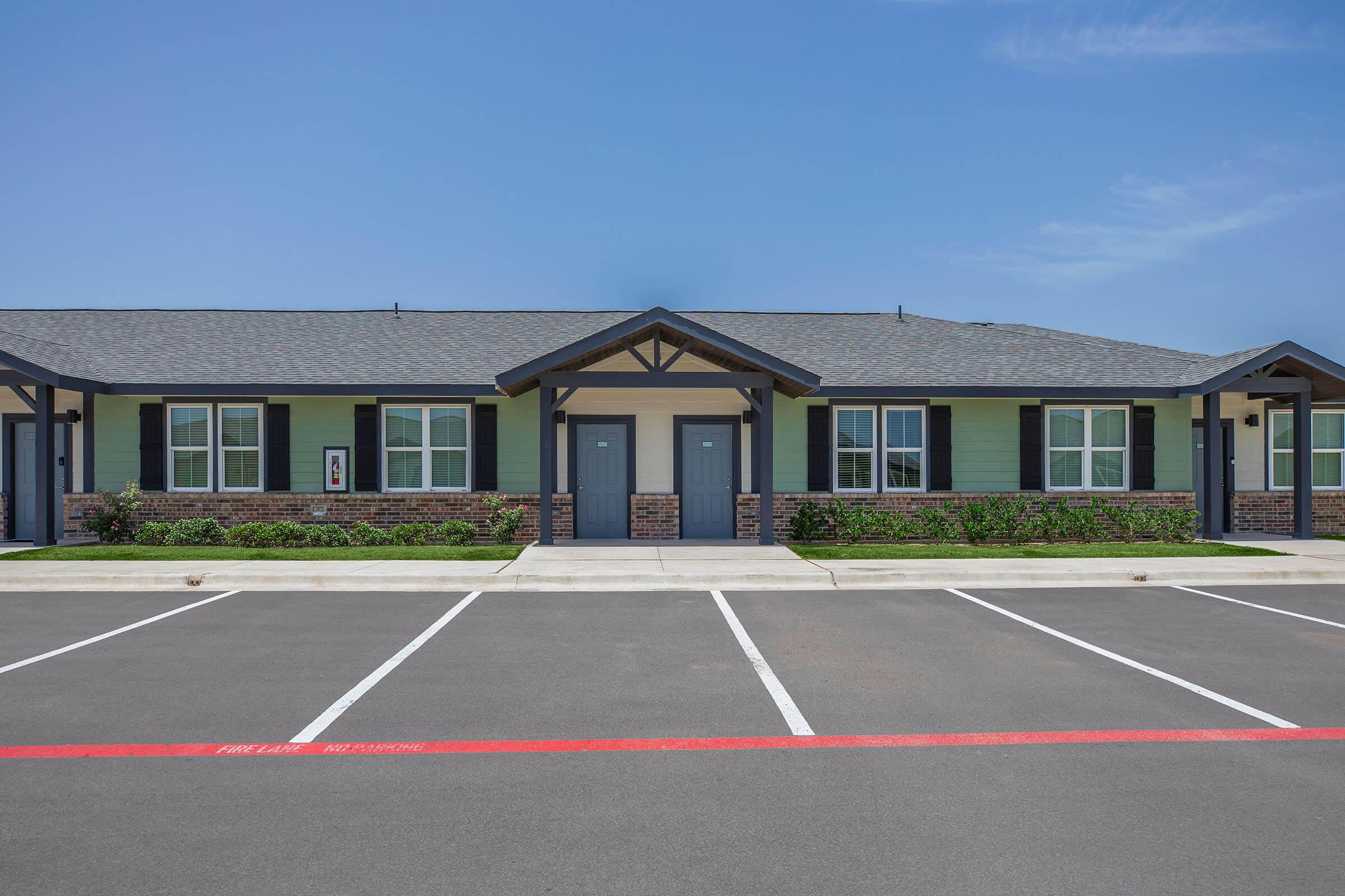 a small house in a parking lot