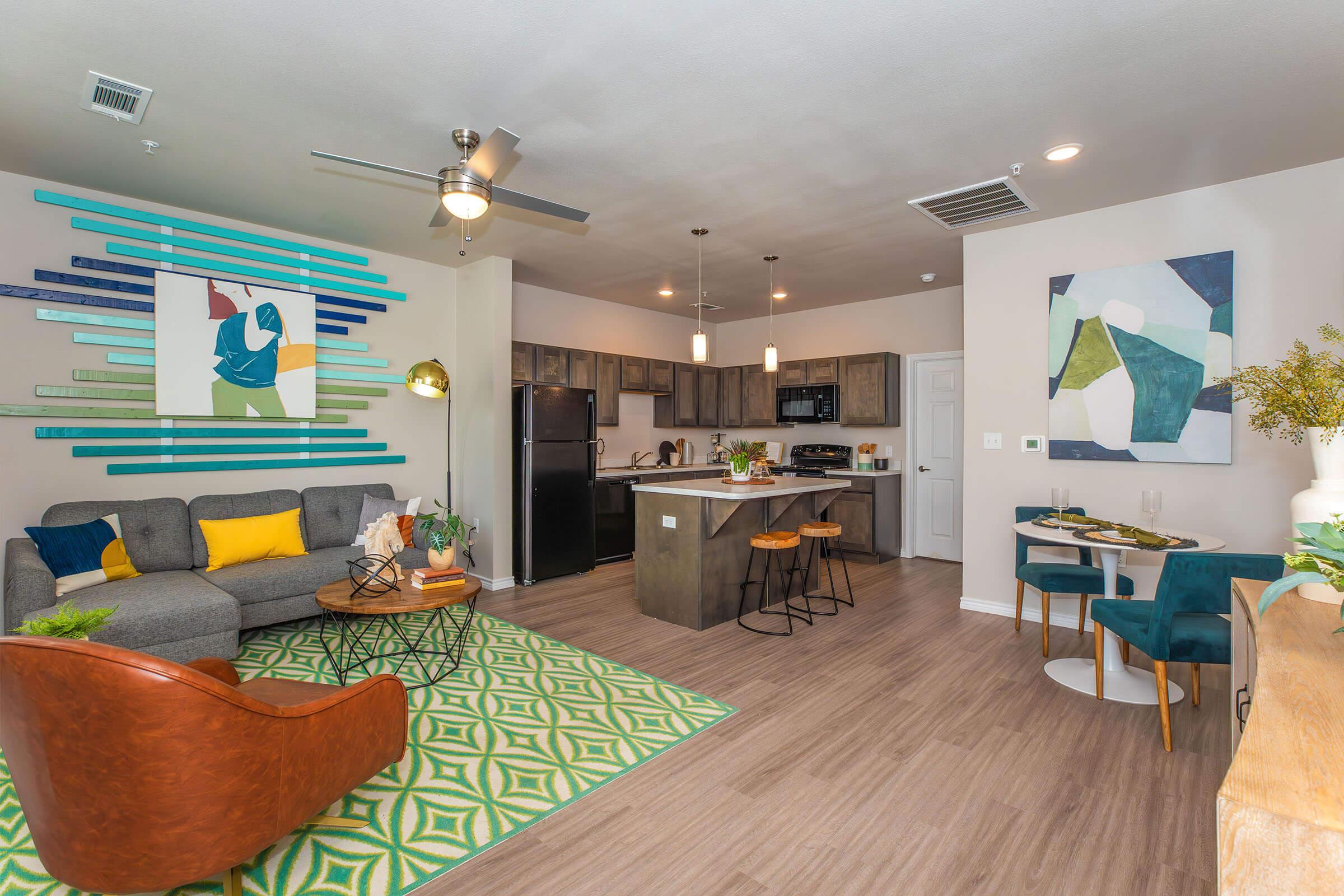 a living room filled with furniture and a flat screen tv