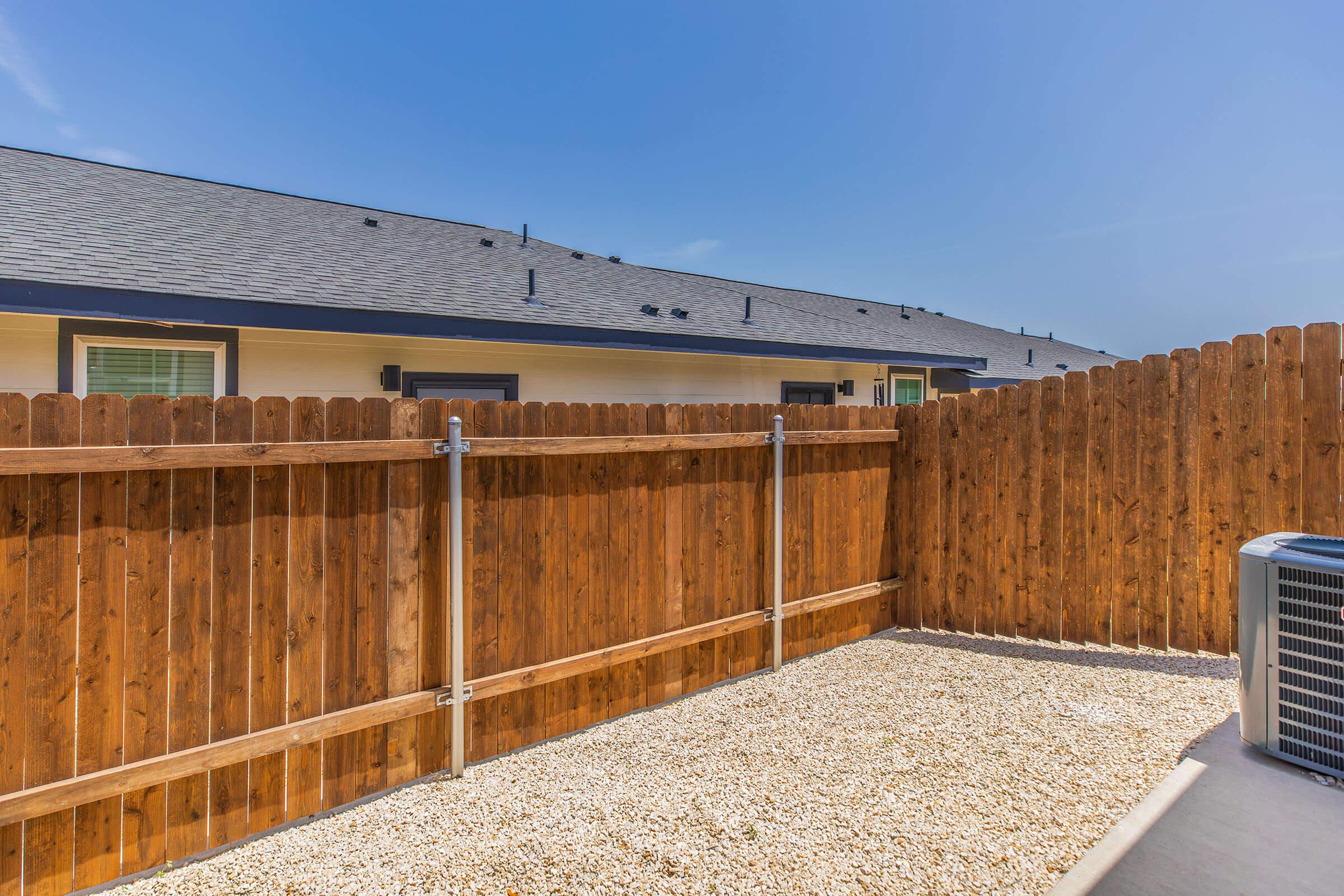 a building with a wooden fence