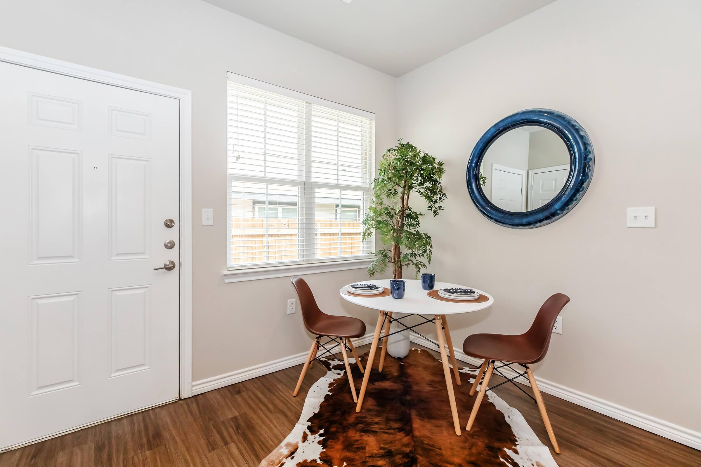 a room filled with furniture and a large window