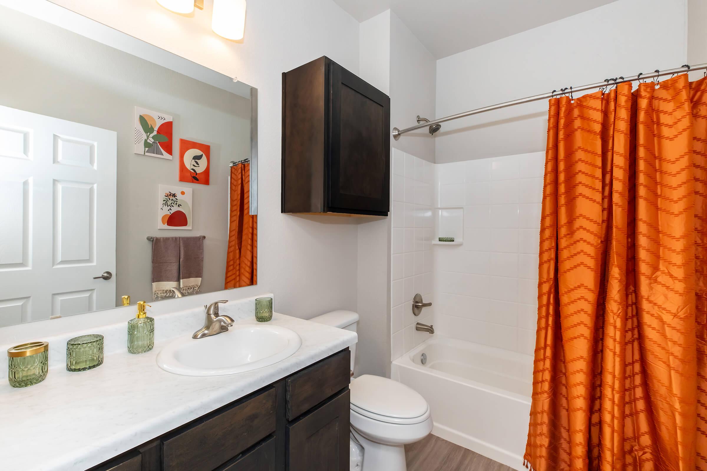 a shower curtain next to a sink