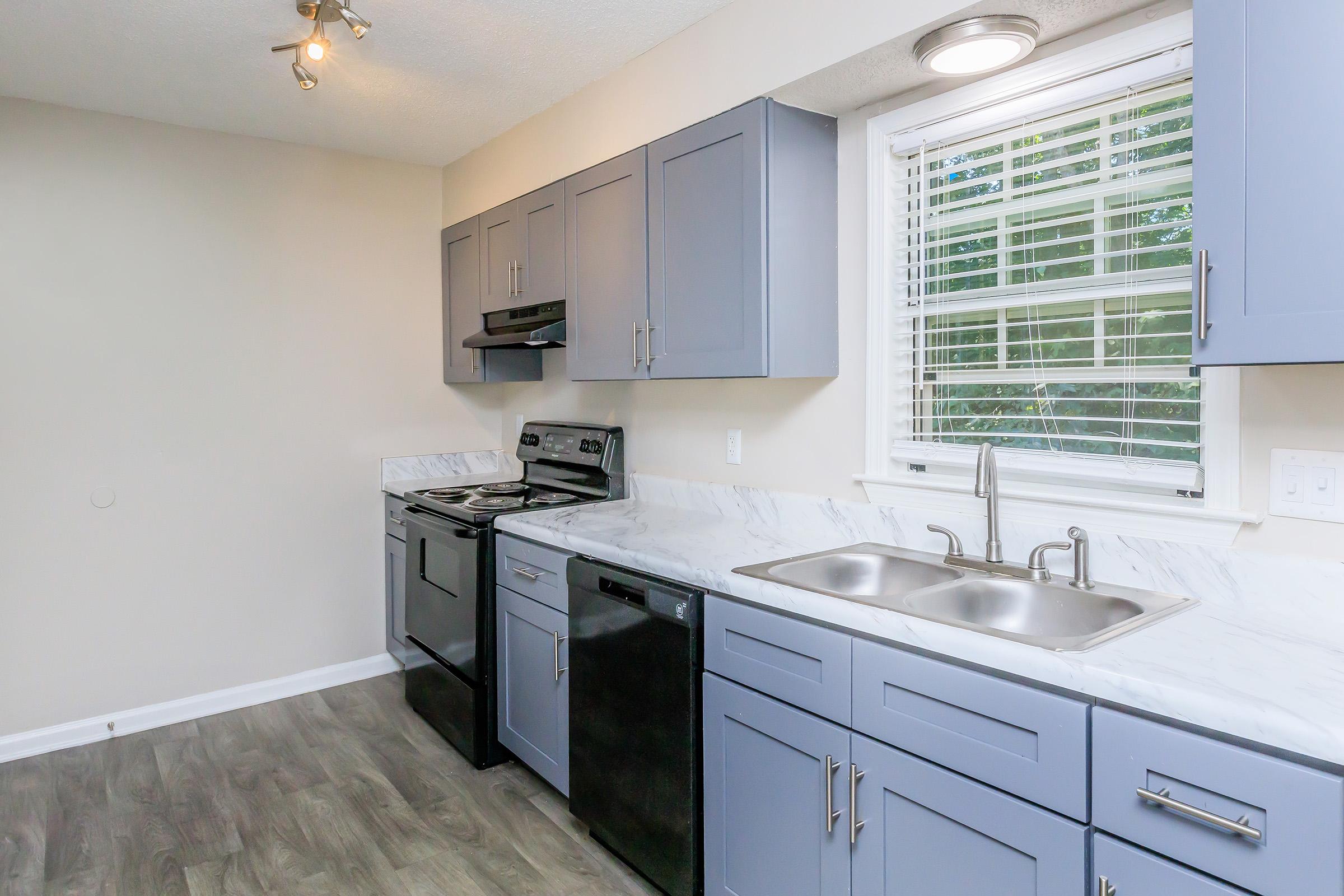 a kitchen with a sink and a microwave