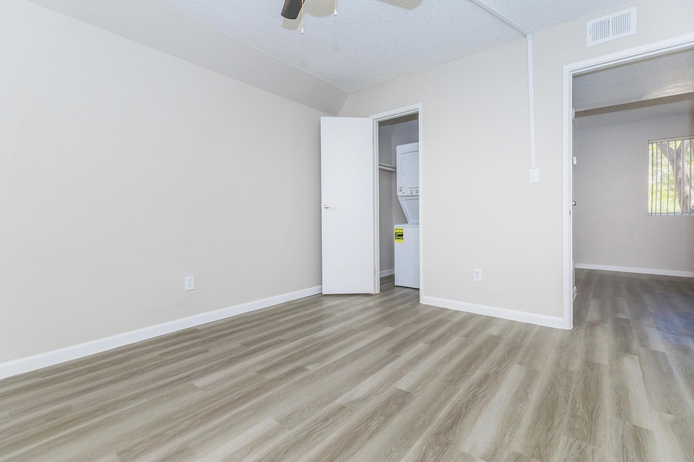 Large empty apartment floor plan with stacked washer and dryer in closet