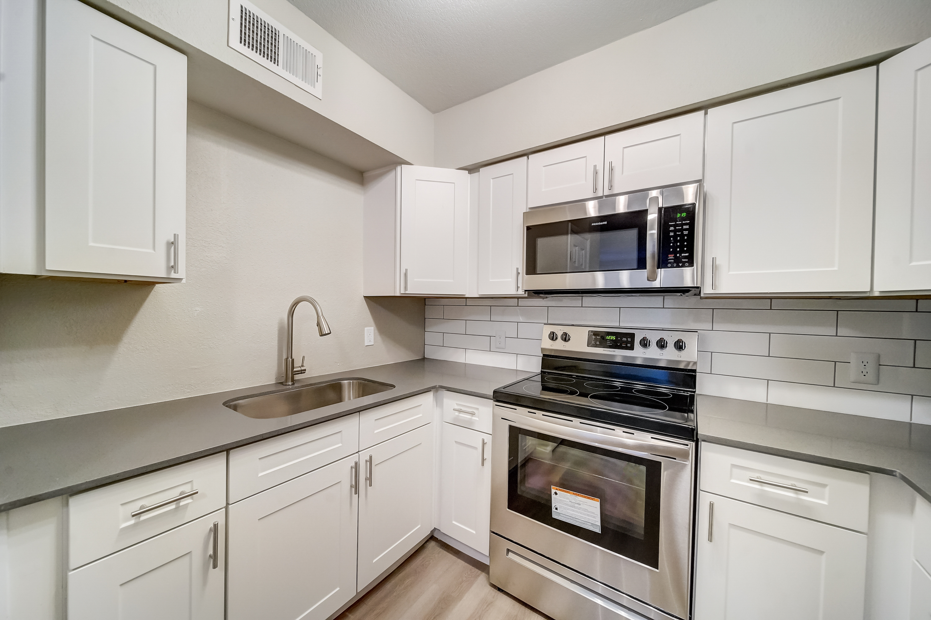 a kitchen with a stove top oven