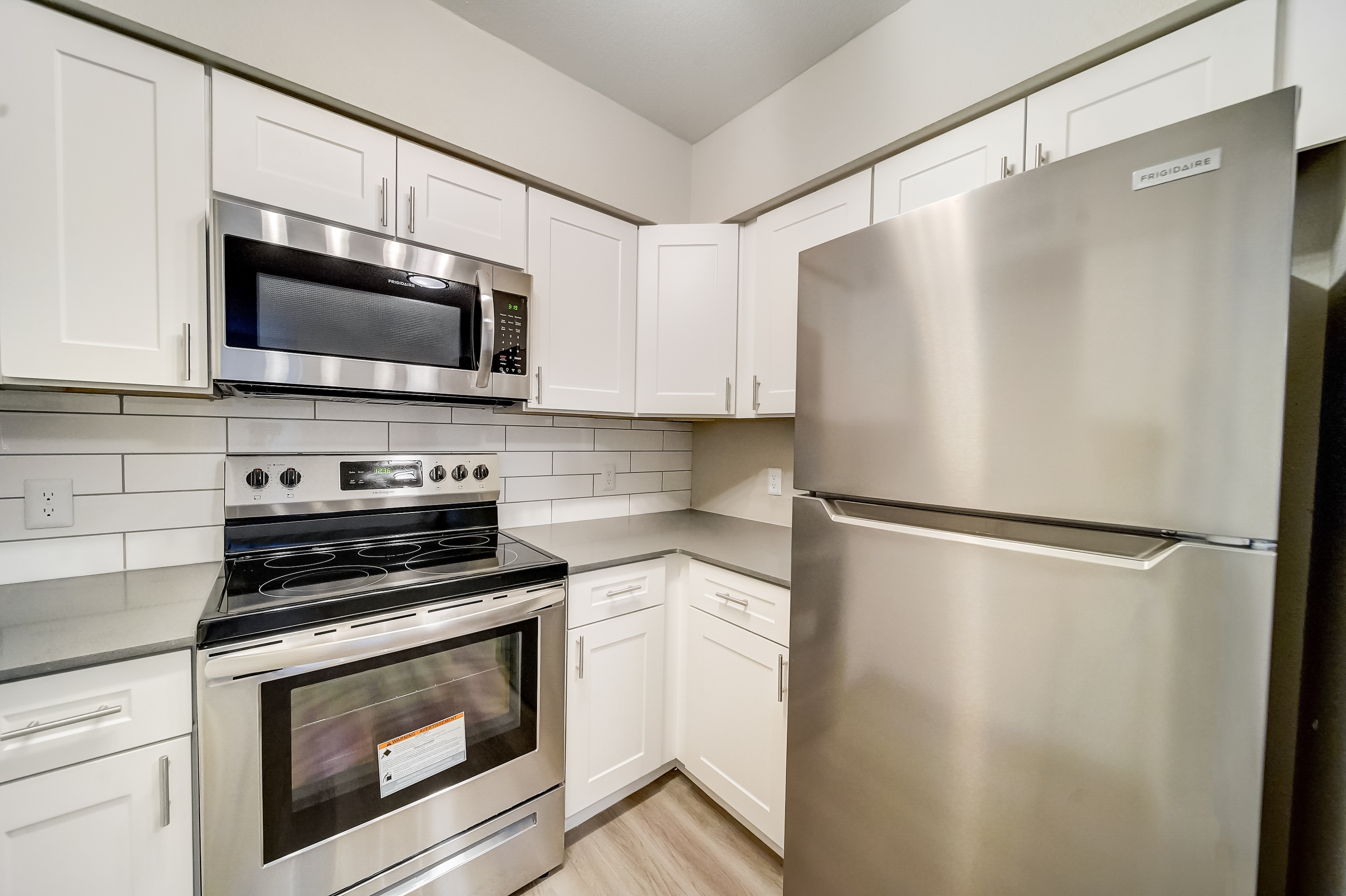 a kitchen with a stove top oven sitting inside of a refrigerator