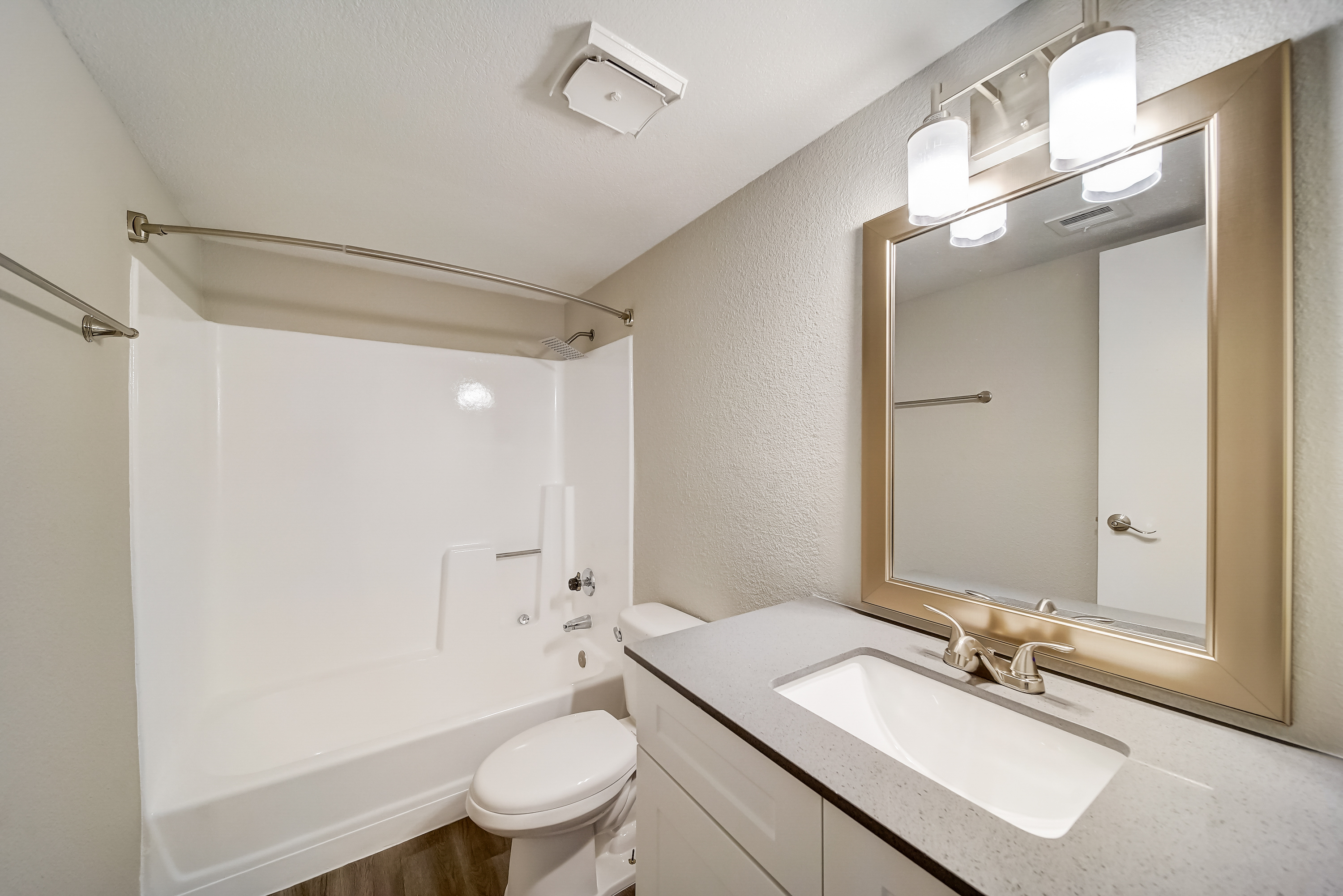 a shower that has a sink and a mirror