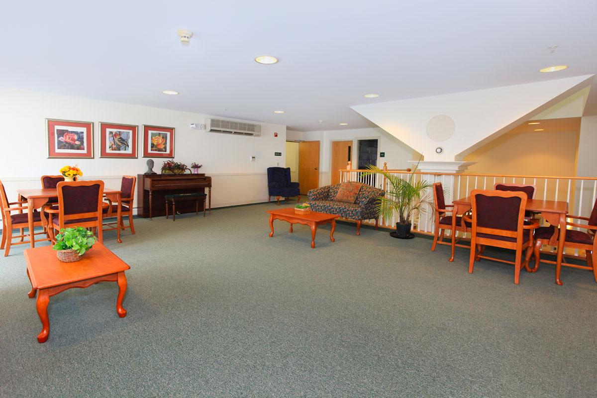 a living room filled with furniture and a table