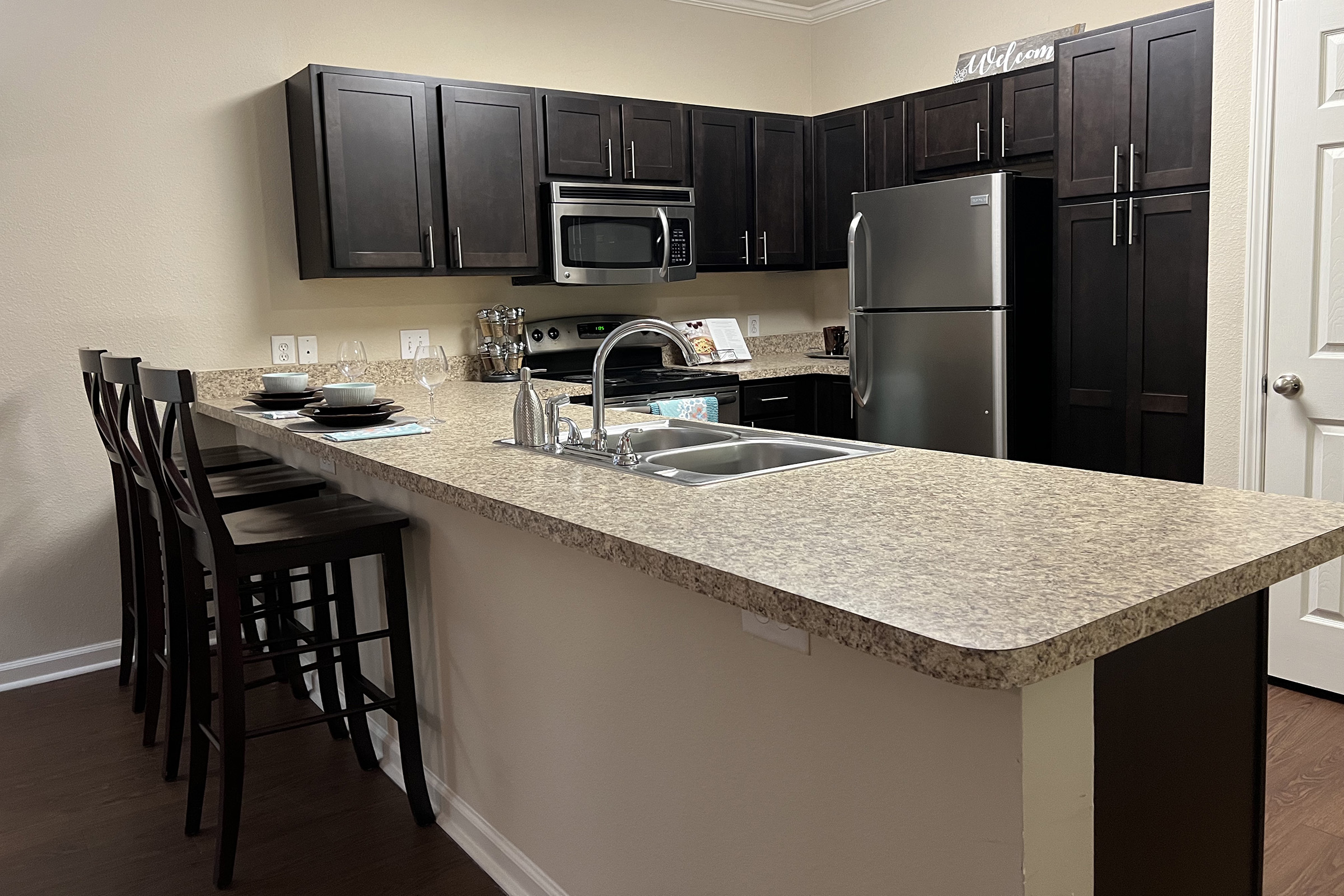 a modern kitchen with an island in the middle of a room