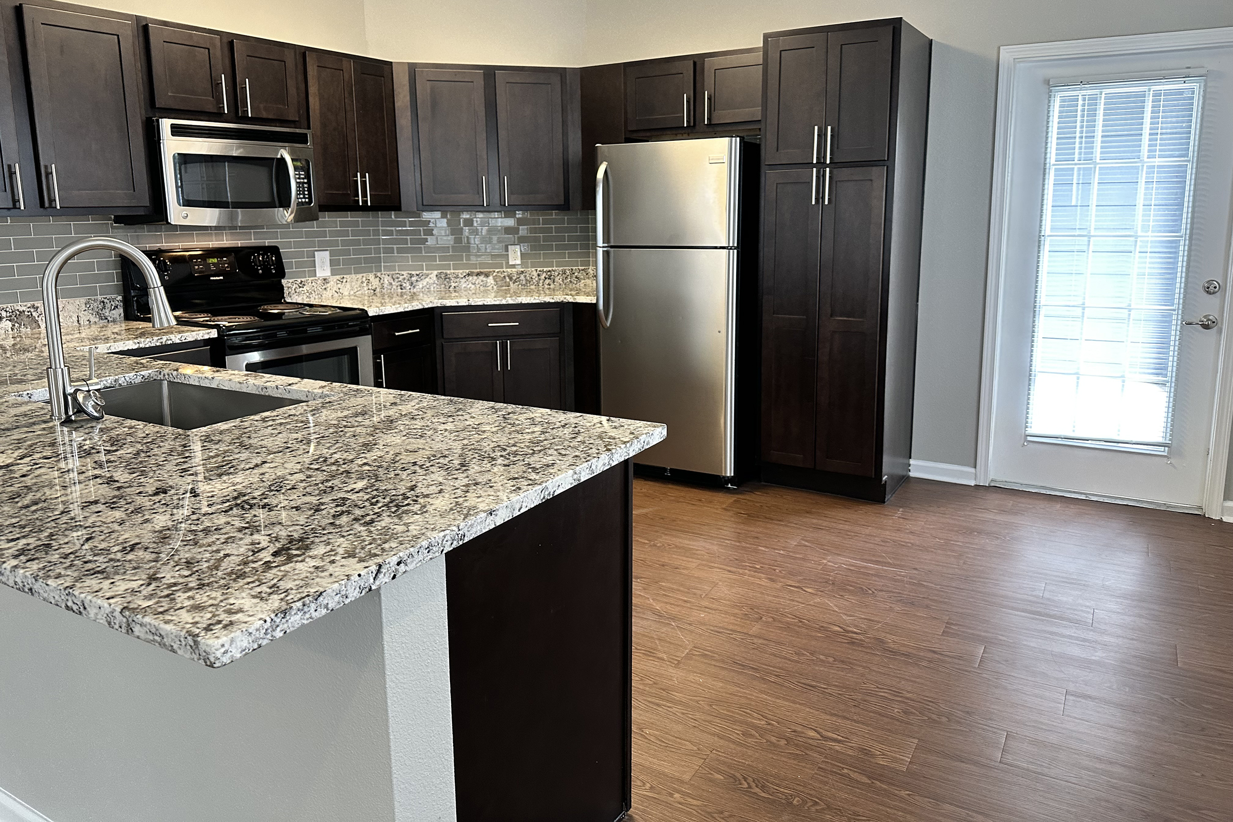 a modern kitchen with stainless steel appliances