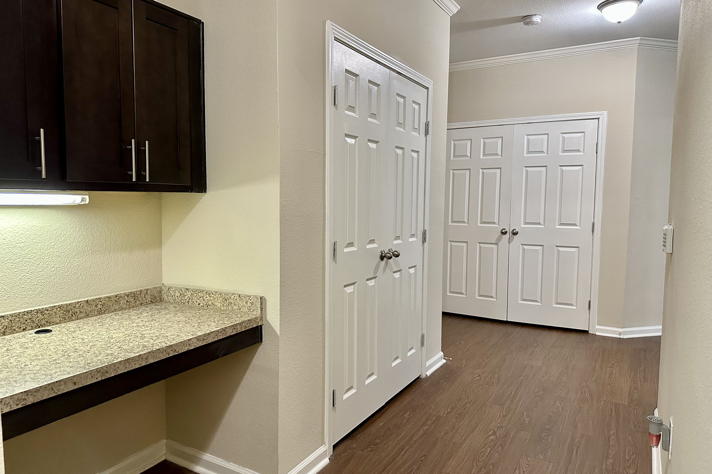 a kitchen with a sink and a mirror