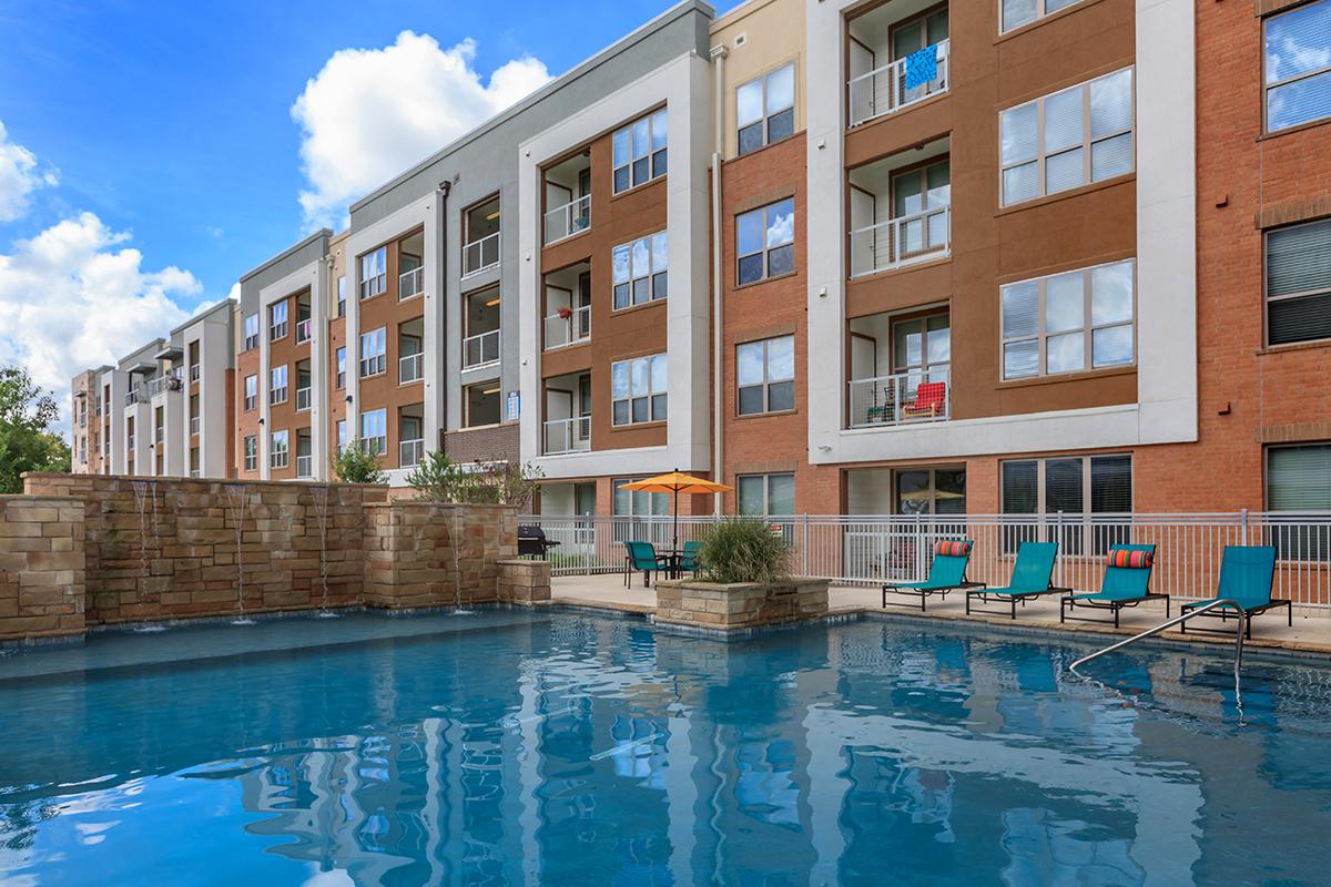 a large pool of water in front of a building