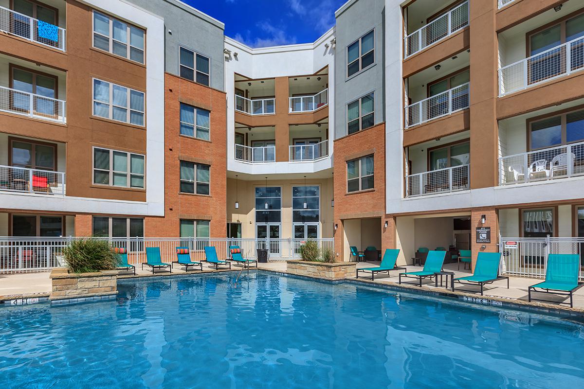 a large pool of water in front of a building